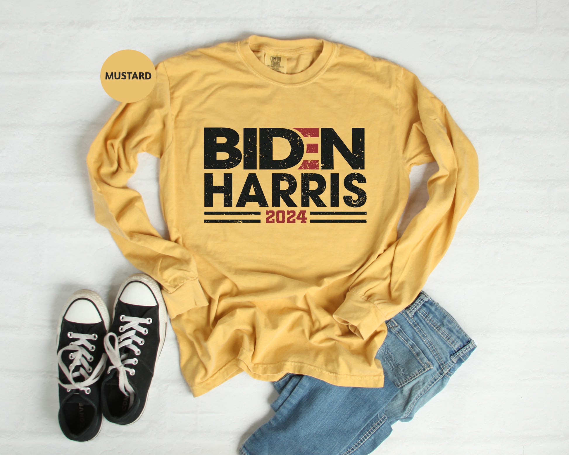 a t - shirt that says bidn harris next to a pair of
