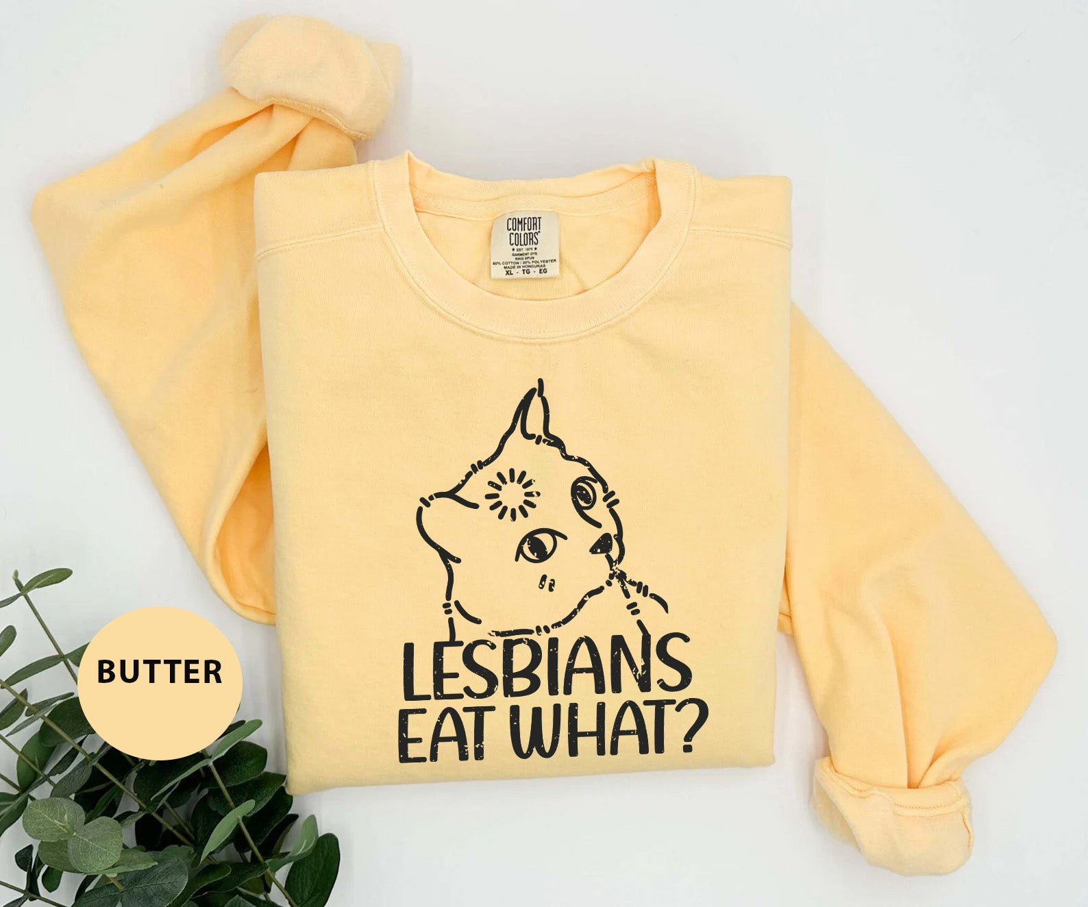 a yellow shirt with a picture of a cat on it