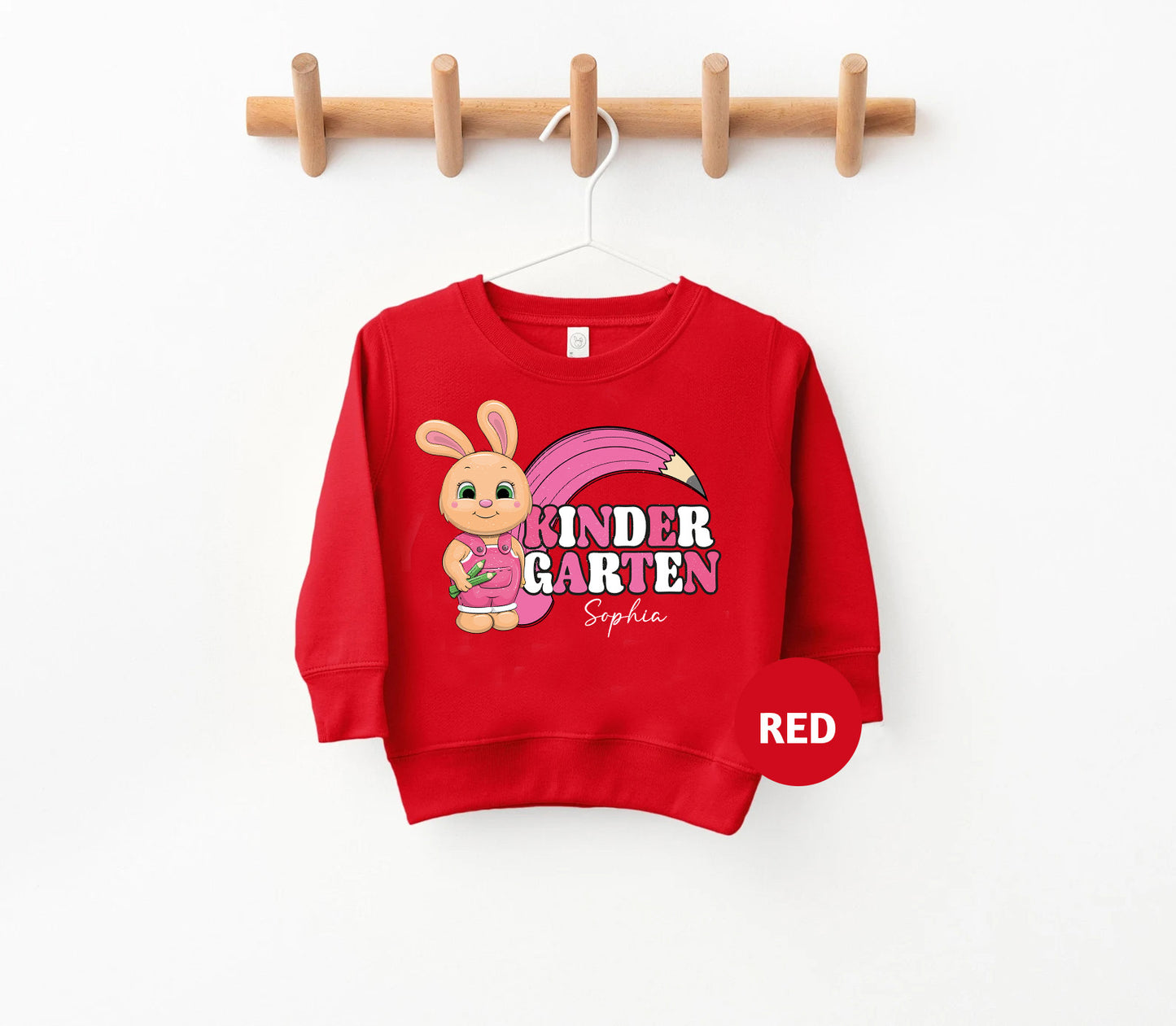 a red sweatshirt hanging on a clothes rack