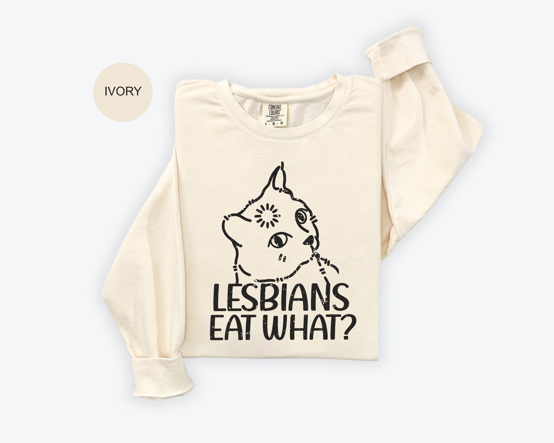 a white t - shirt with the words lesbians eat what? on it