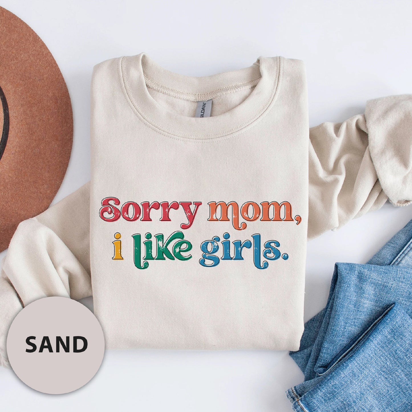 a t - shirt that says sorry mom i like girls next to a cowboy hat