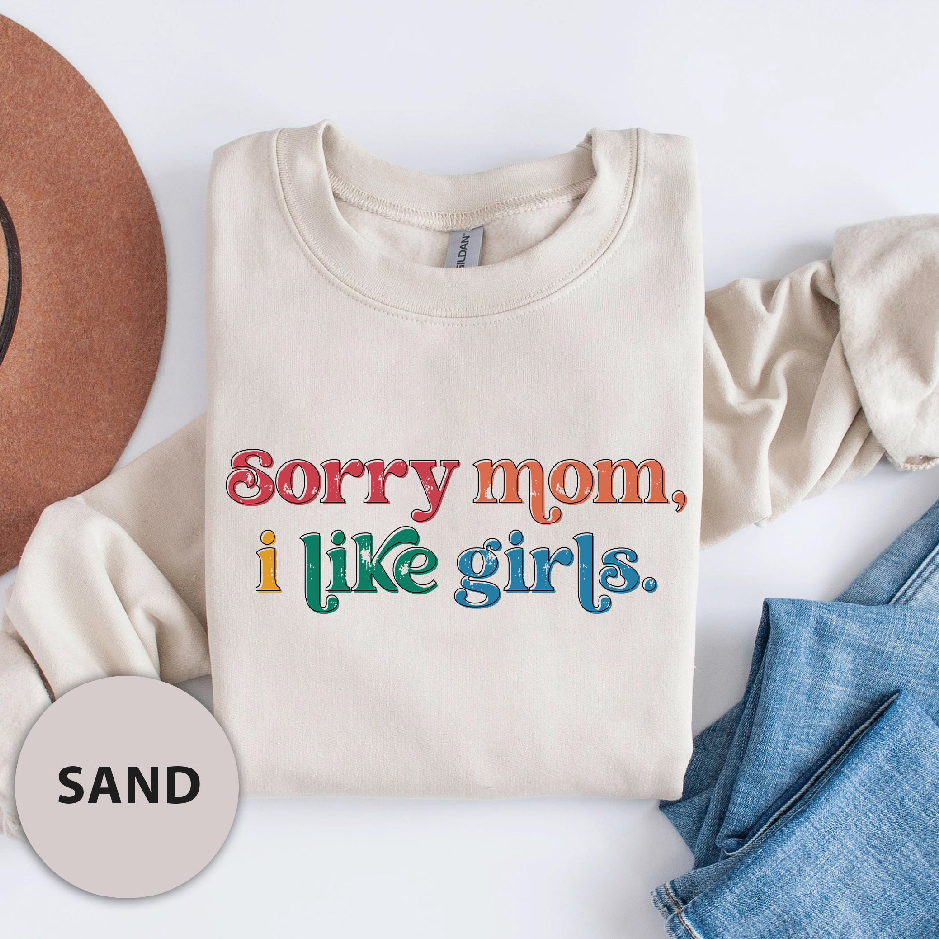 a t - shirt that says sorry mom i like girls next to a cowboy hat