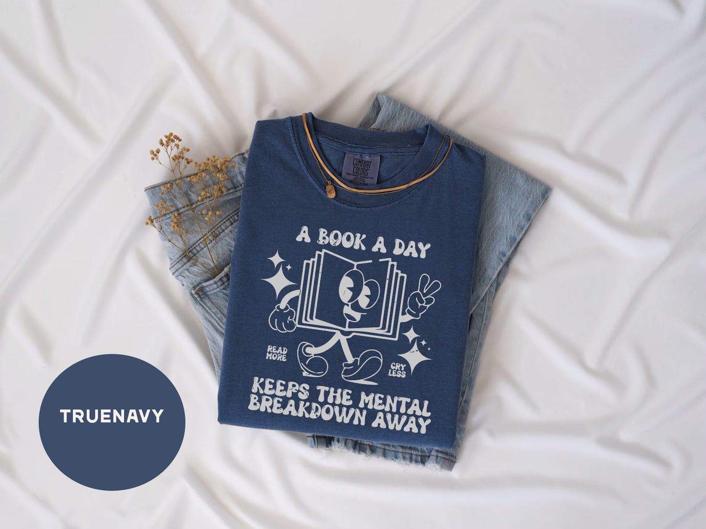 a t - shirt that reads a book a day keeps the mental breakdown away