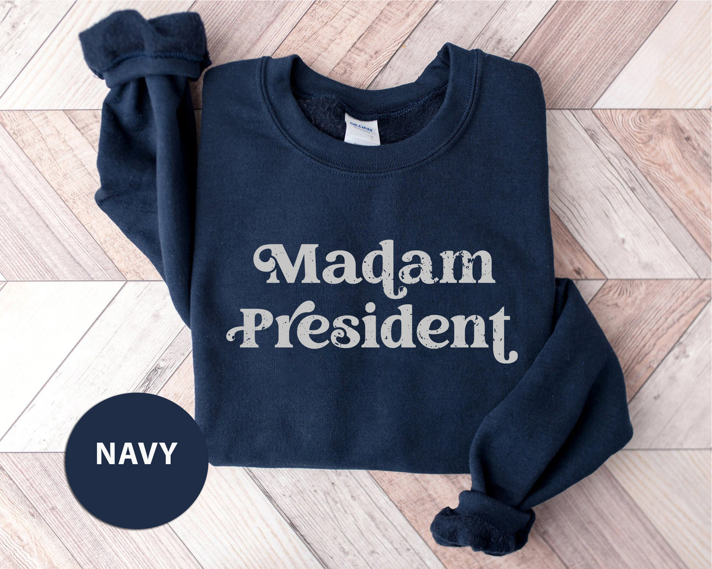 a navy sweatshirt with the words madam president on it
