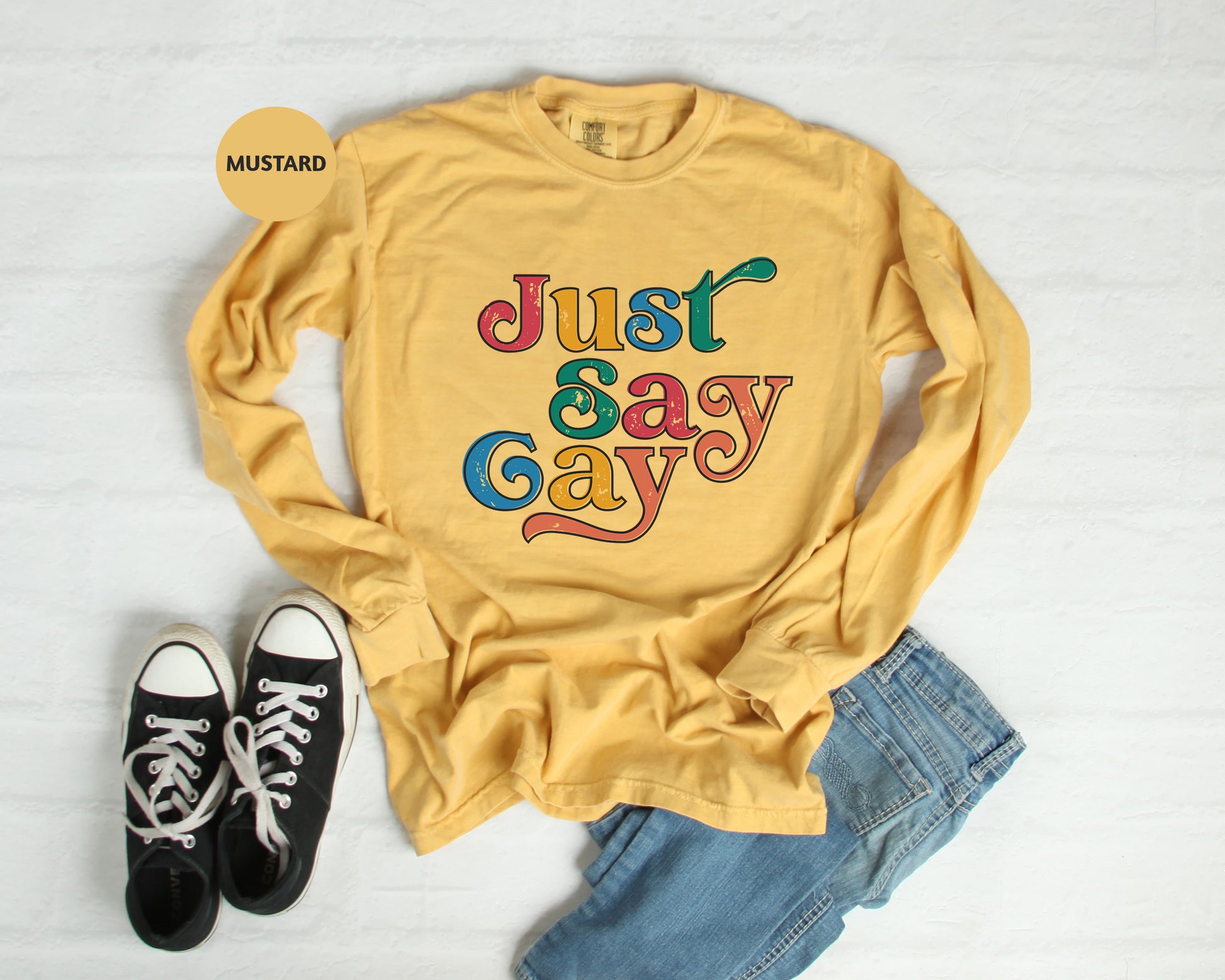 a yellow shirt that says just say gay on it