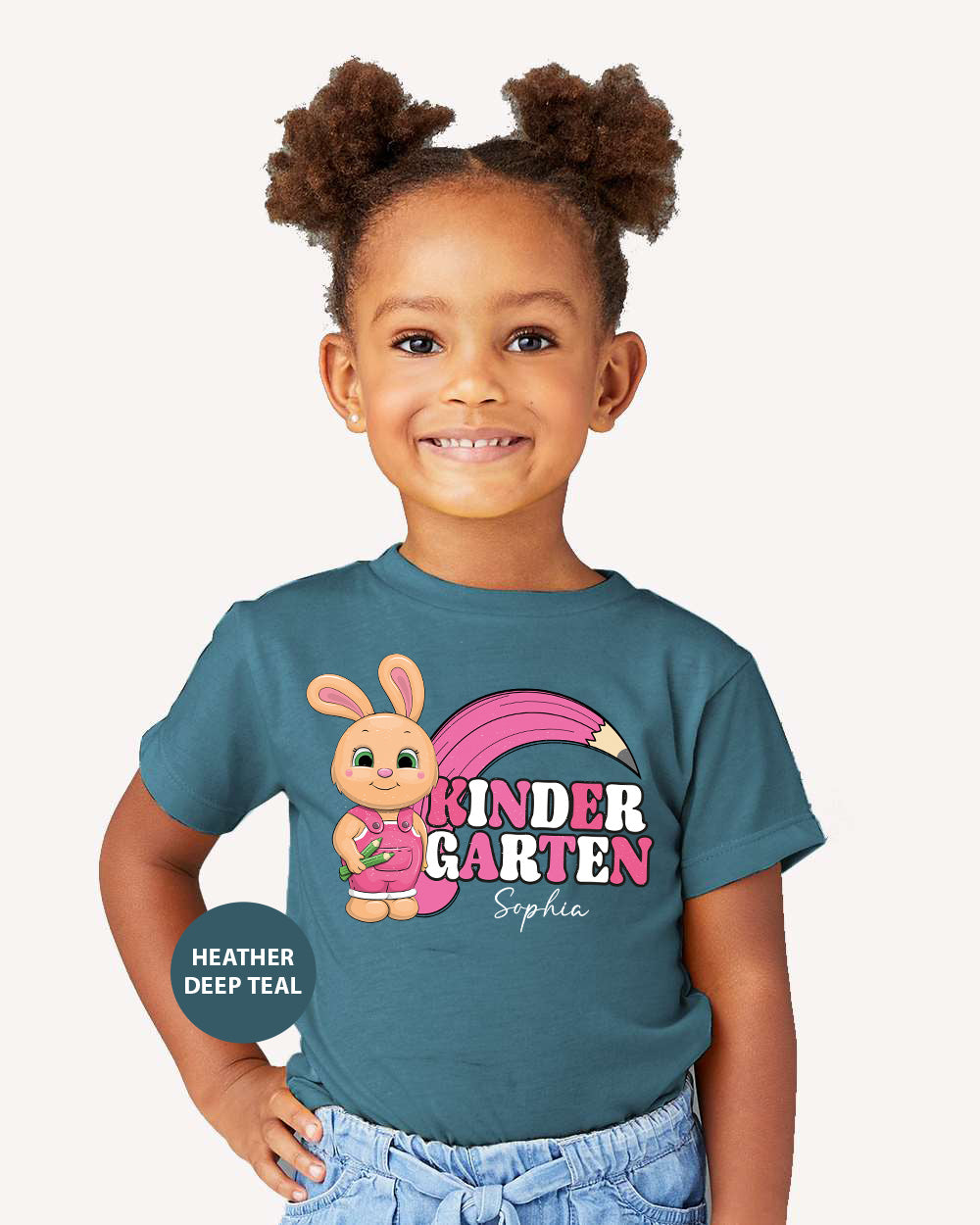 a little girl wearing a t - shirt with a cartoon character on it