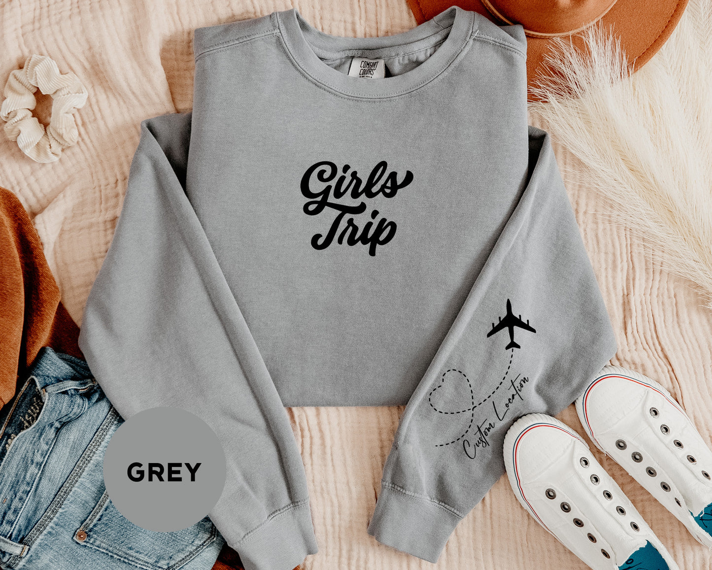 a grey sweatshirt with the words girls trip on it