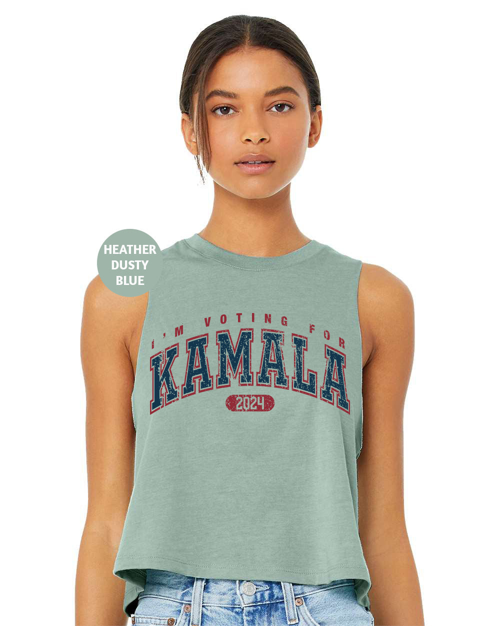 a woman wearing a tank top with the word kansas on it