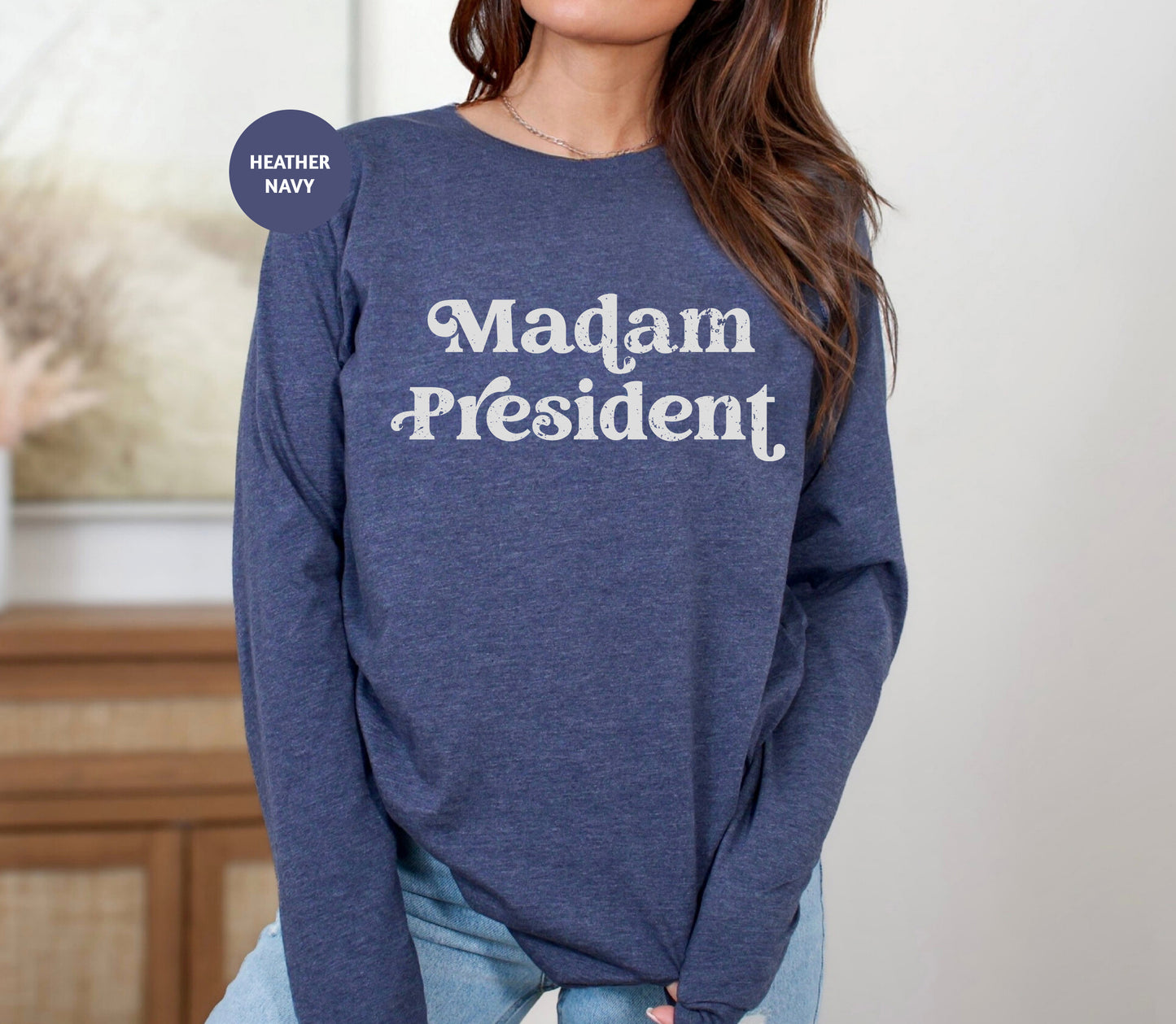a woman wearing a sweatshirt that says madam president
