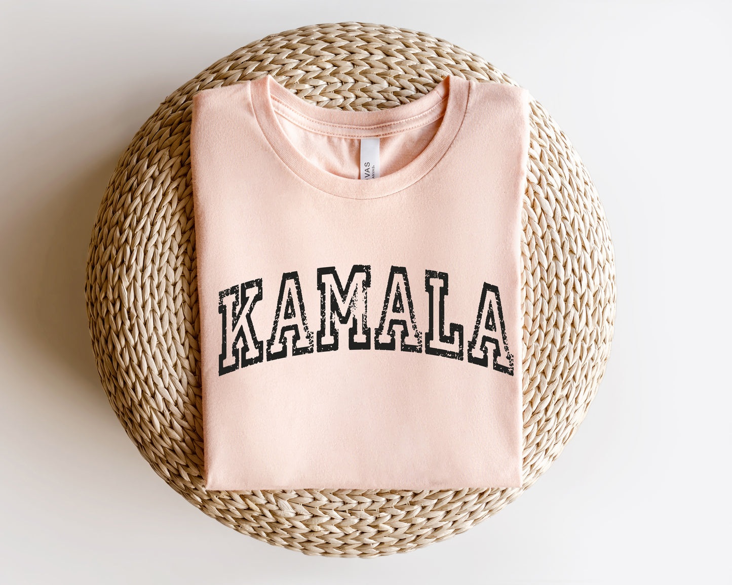 a pink t - shirt with the word kamala printed on it