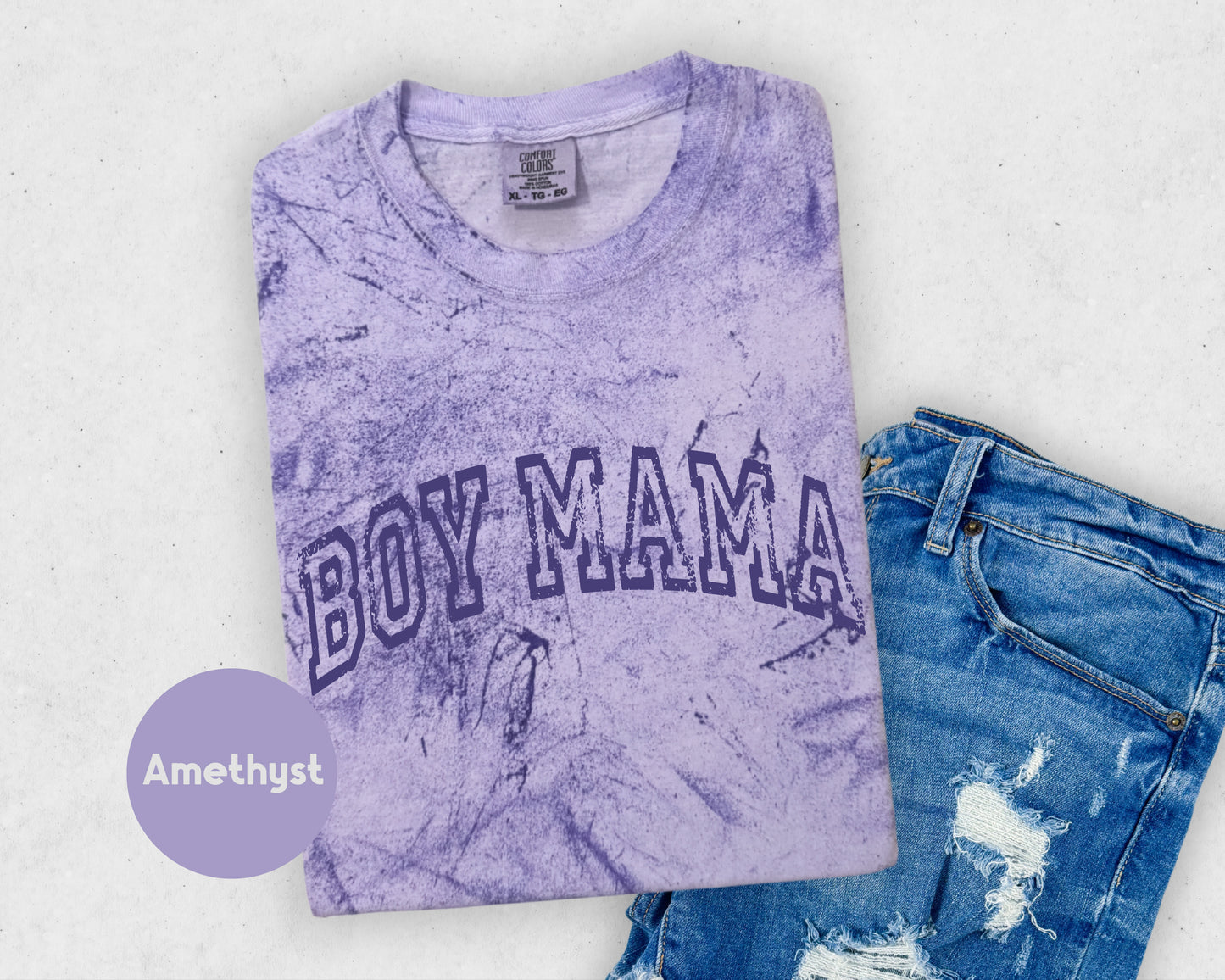 a purple shirt with the word boy mama printed on it