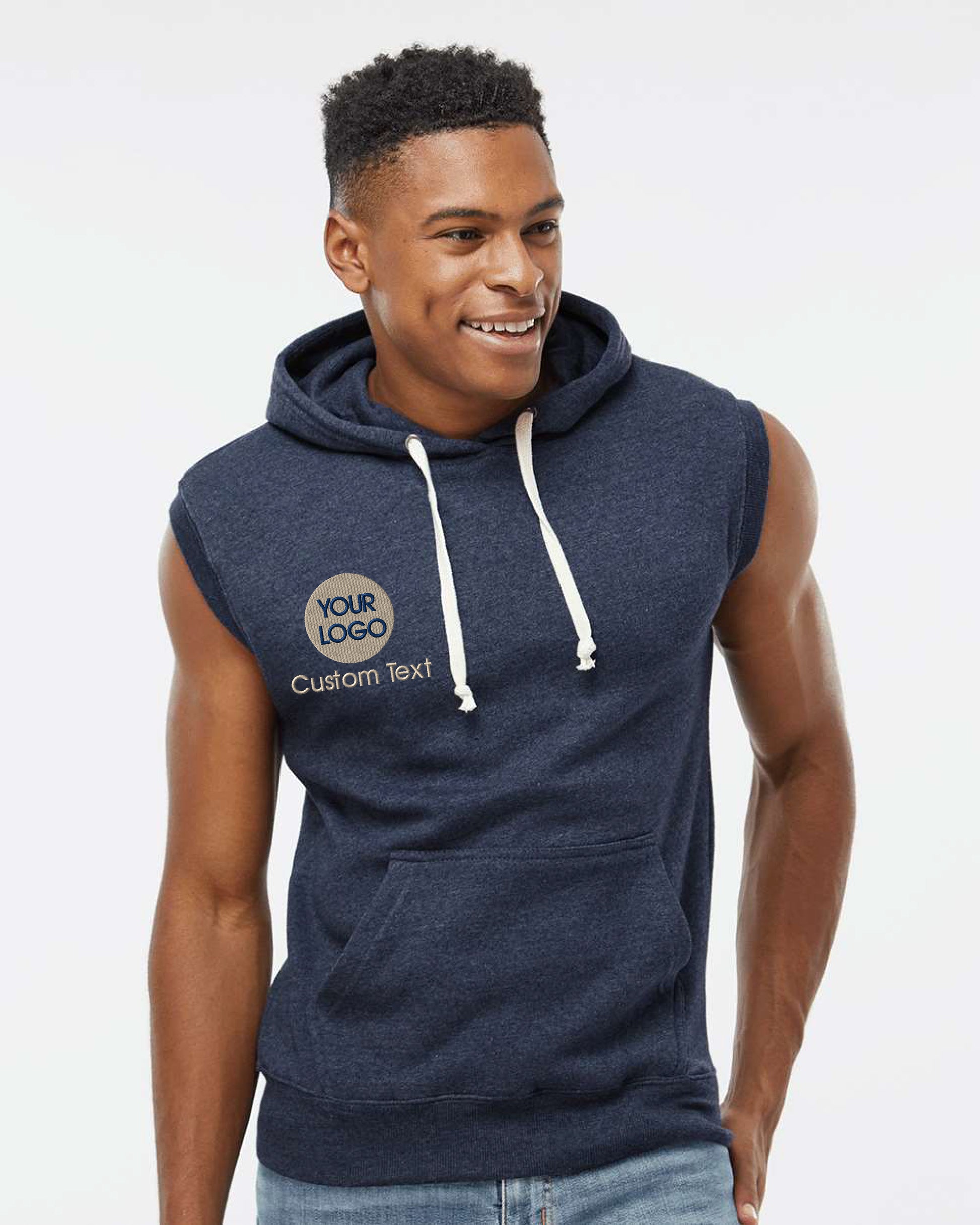 a man in a blue hoodie smiles at the camera