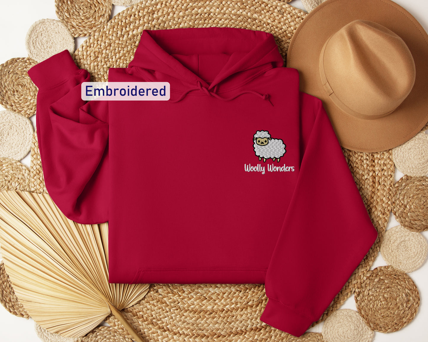 a red hoodie with a white sheep on it