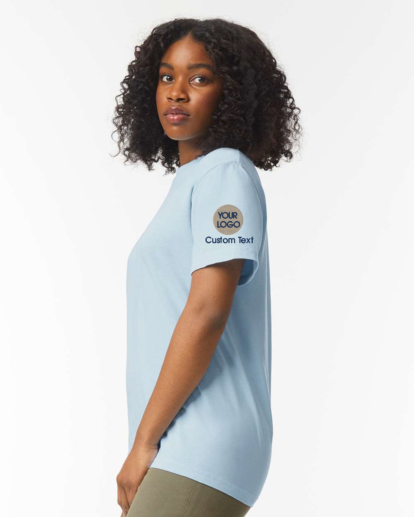 a woman wearing a blue shirt and khaki pants