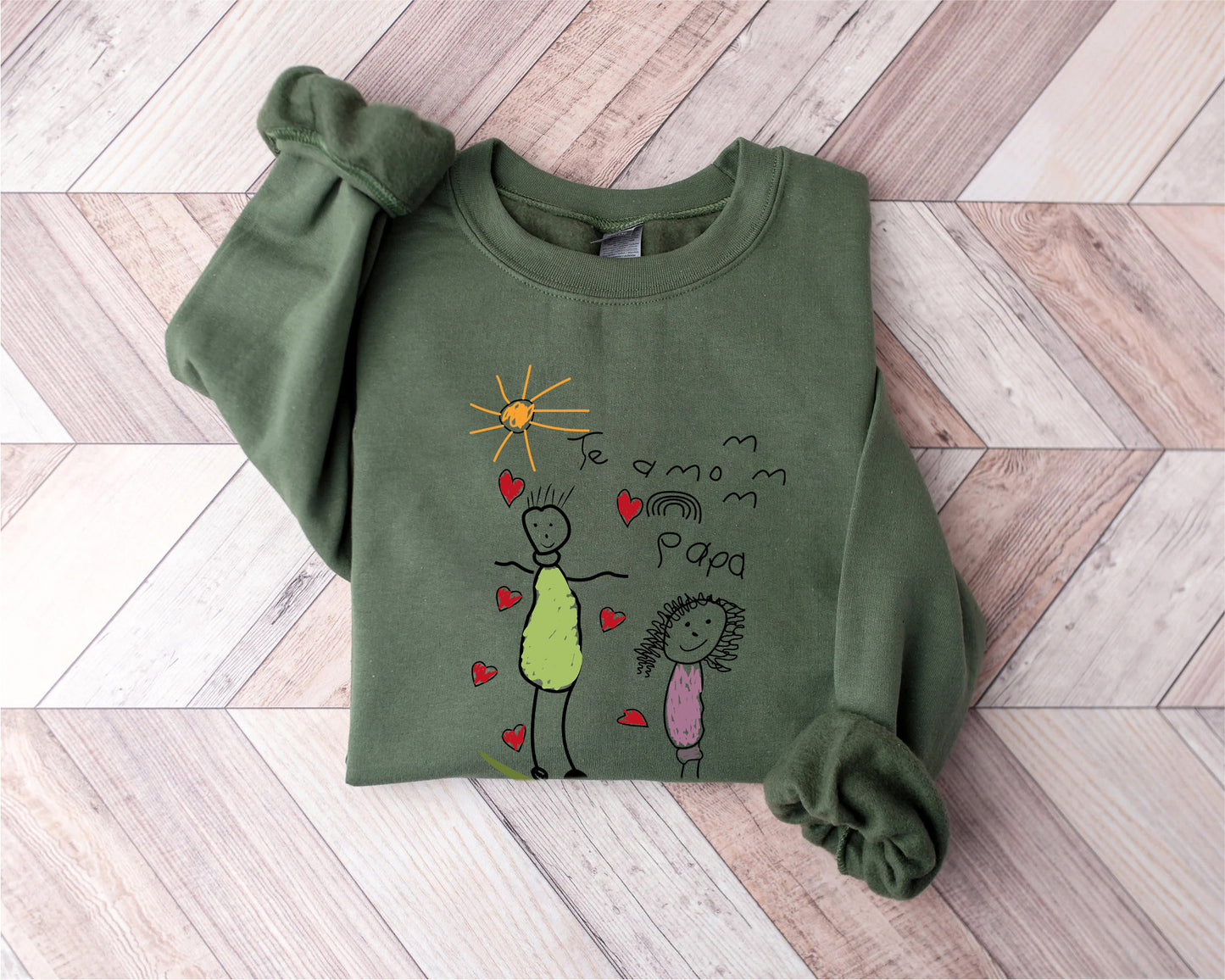 a green shirt with a drawing of a woman and a child