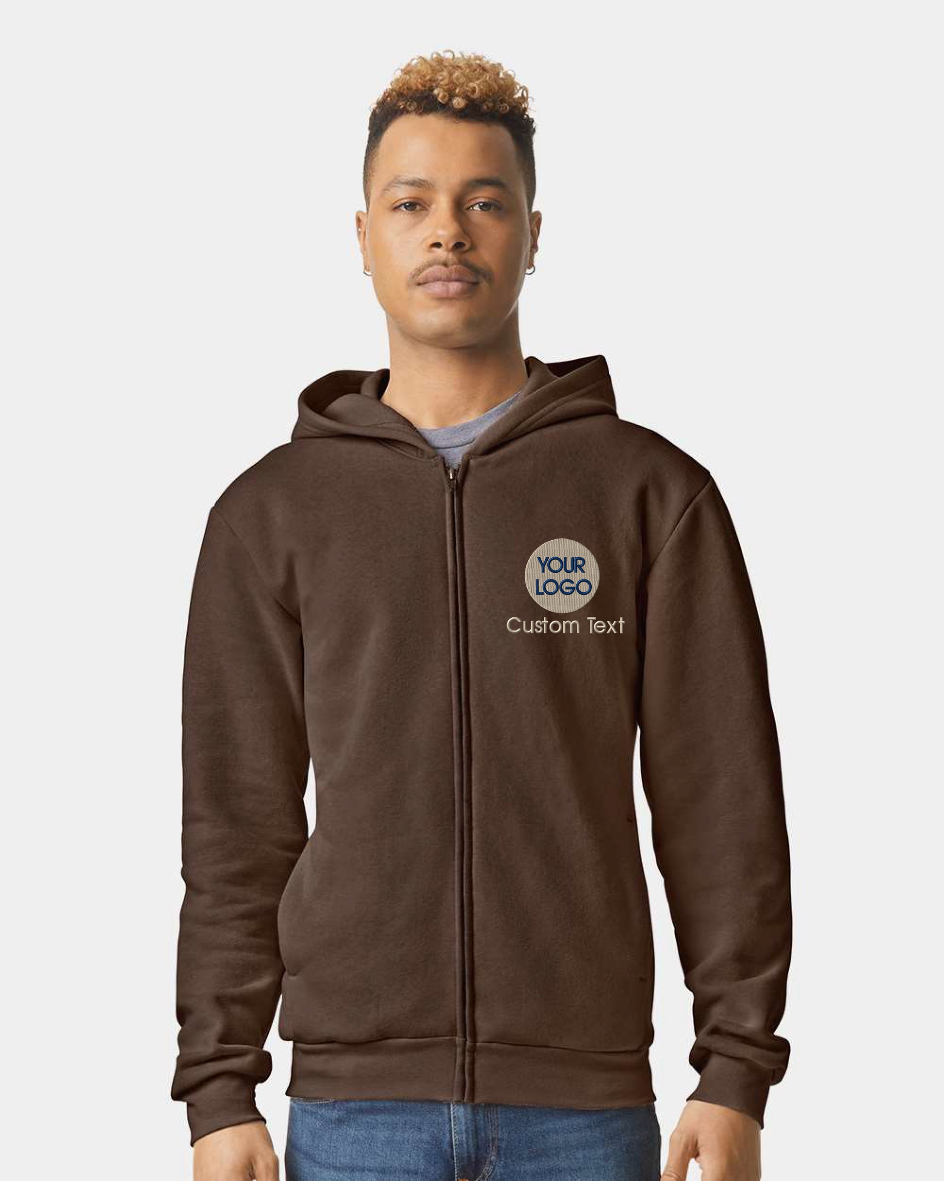 a man wearing a brown hoodie with a logo on it