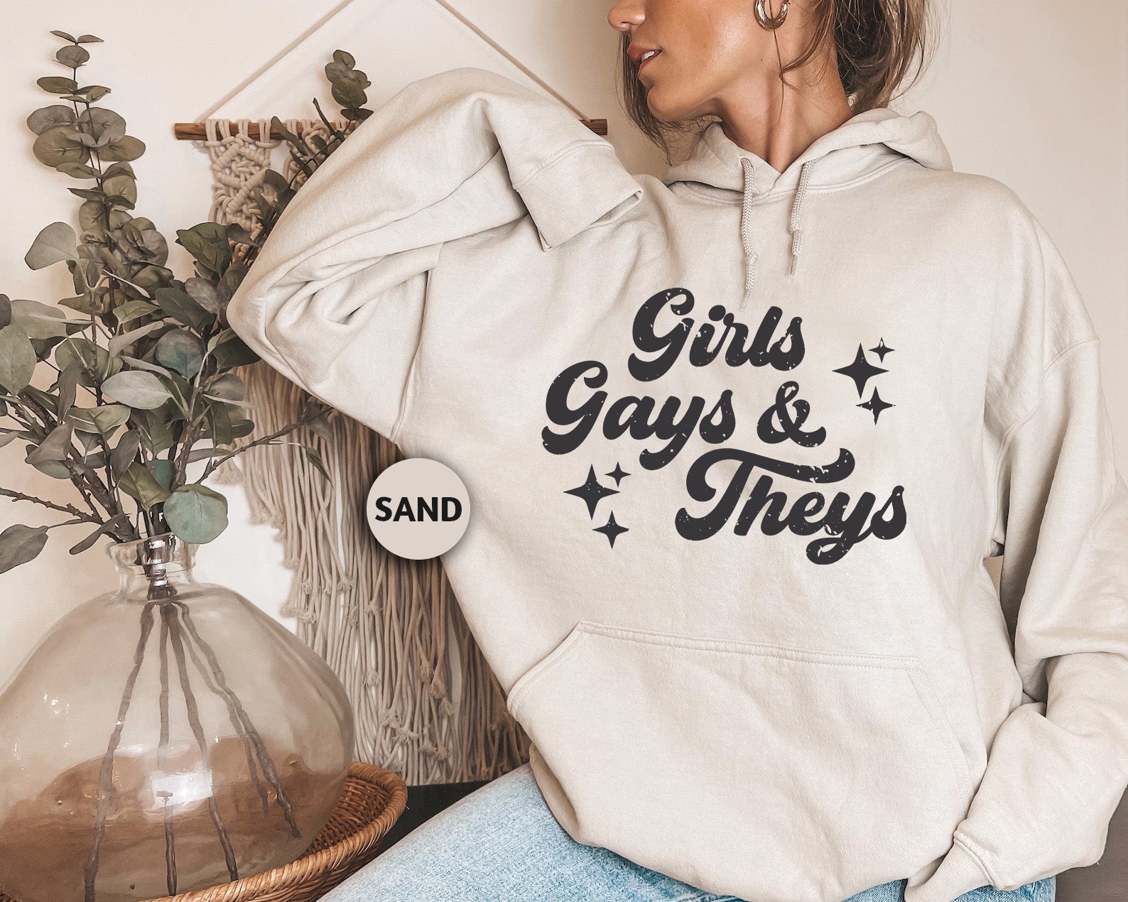 a woman wearing a white hoodie that says girls, guys and they