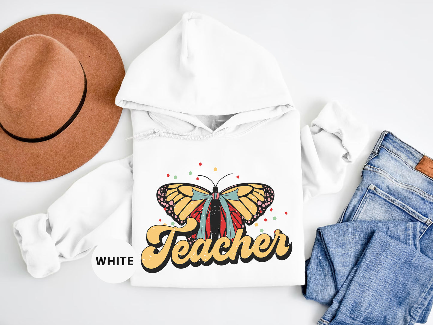 a white hoodie with a yellow butterfly on it