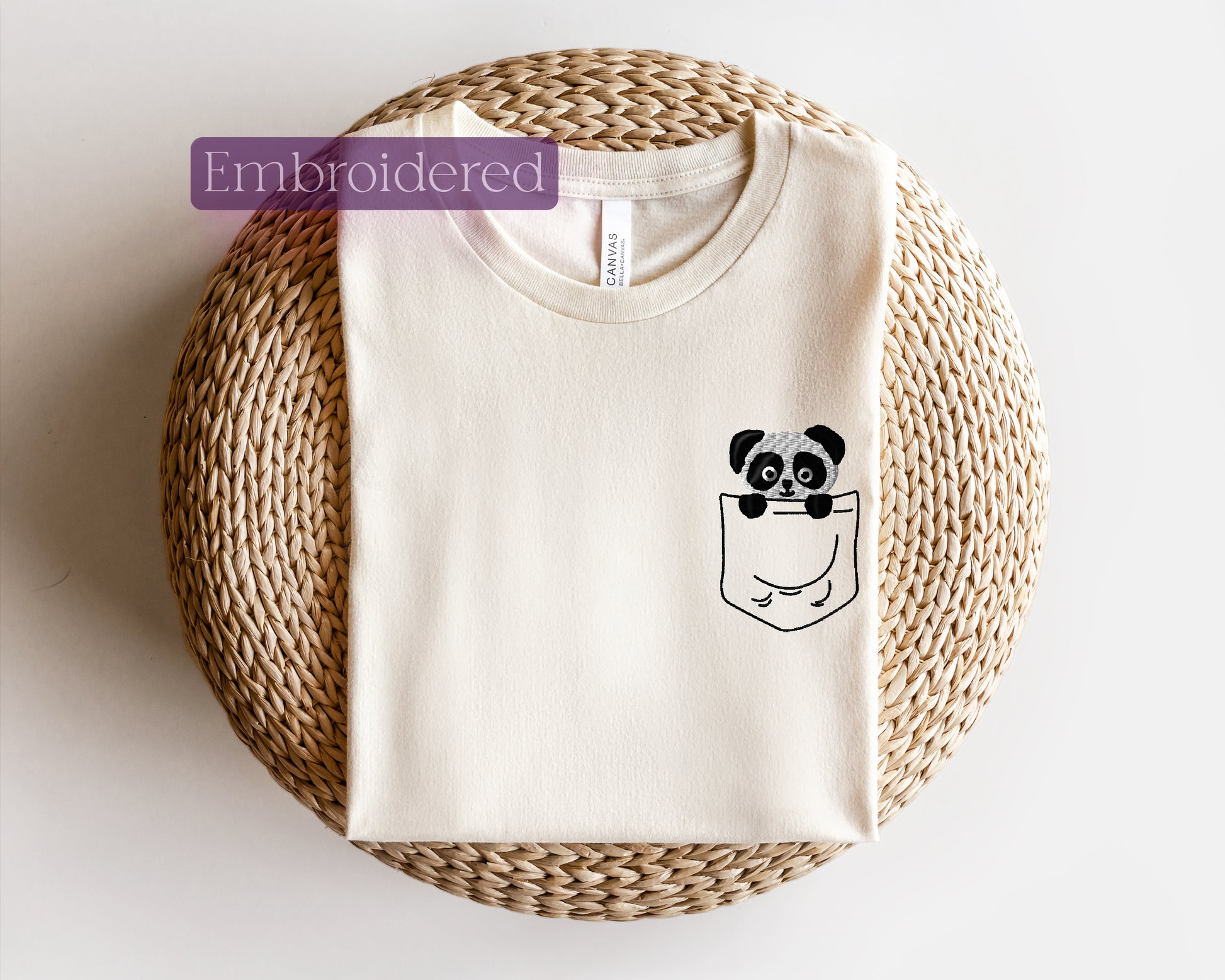 a t - shirt with a panda in a pocket on it