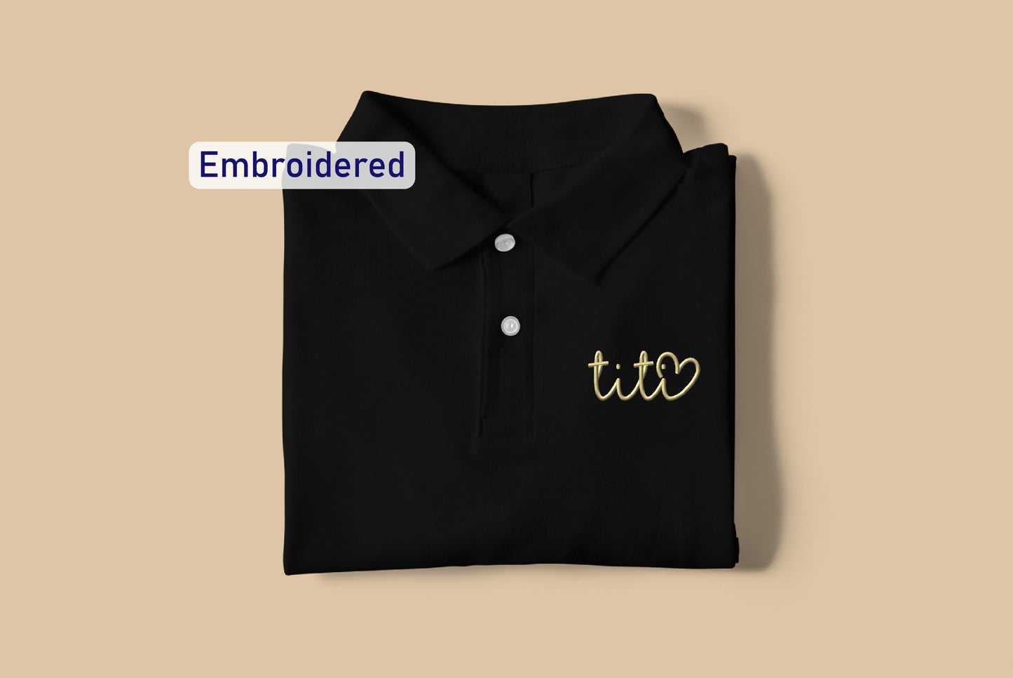 a black polo shirt with the words embroidered on it