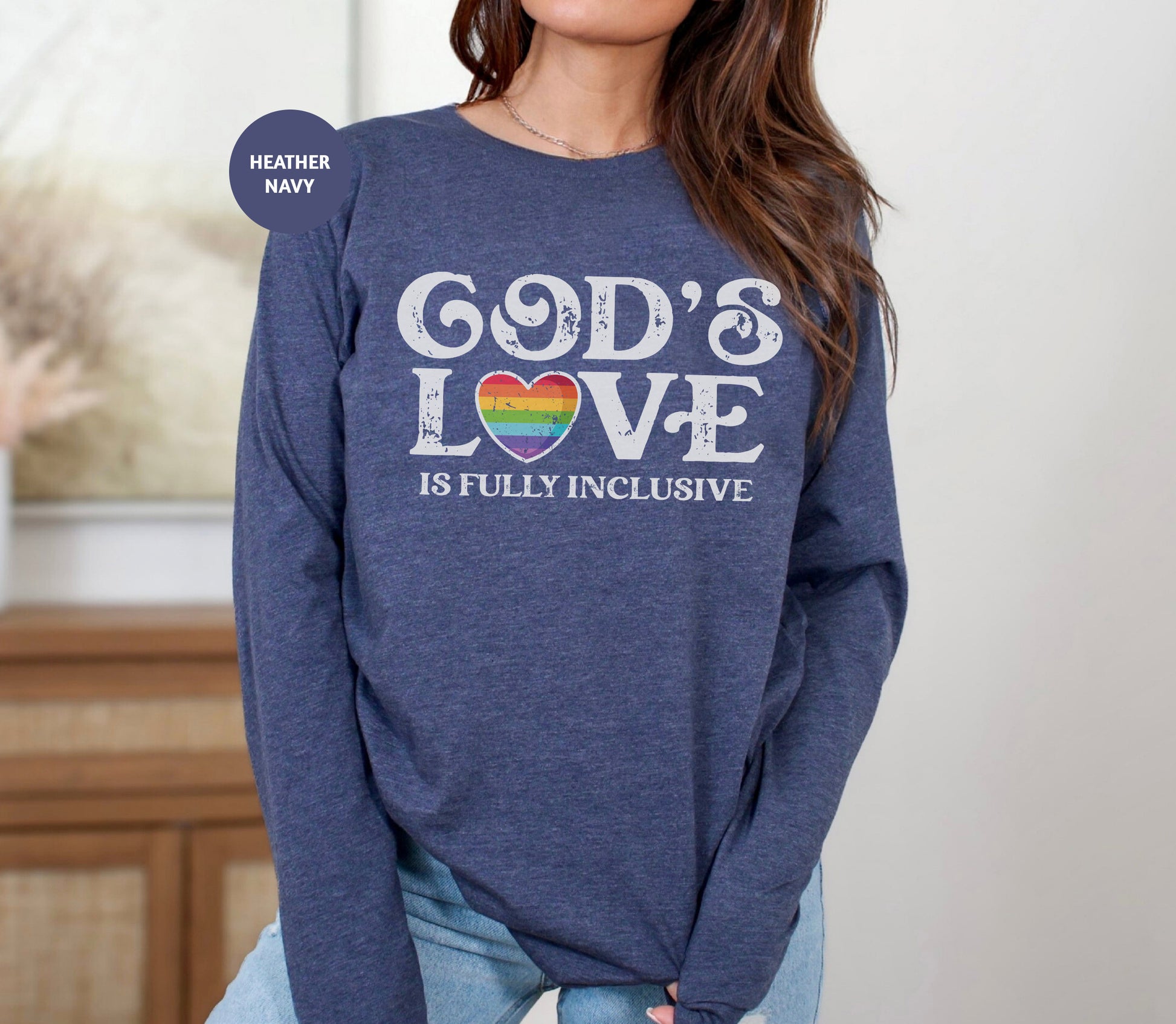 a woman wearing a sweatshirt that says god's love is fully inclusive