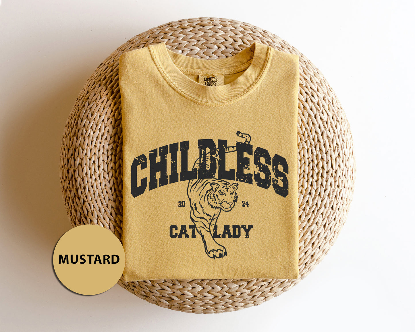 a child's t - shirt sitting on top of a wicker basket