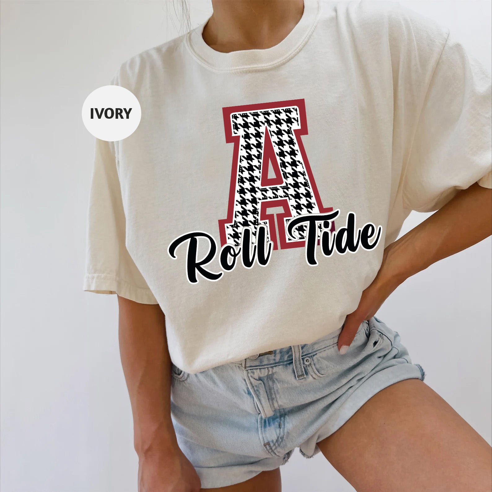 a woman wearing a t - shirt with the word roll tide printed on it