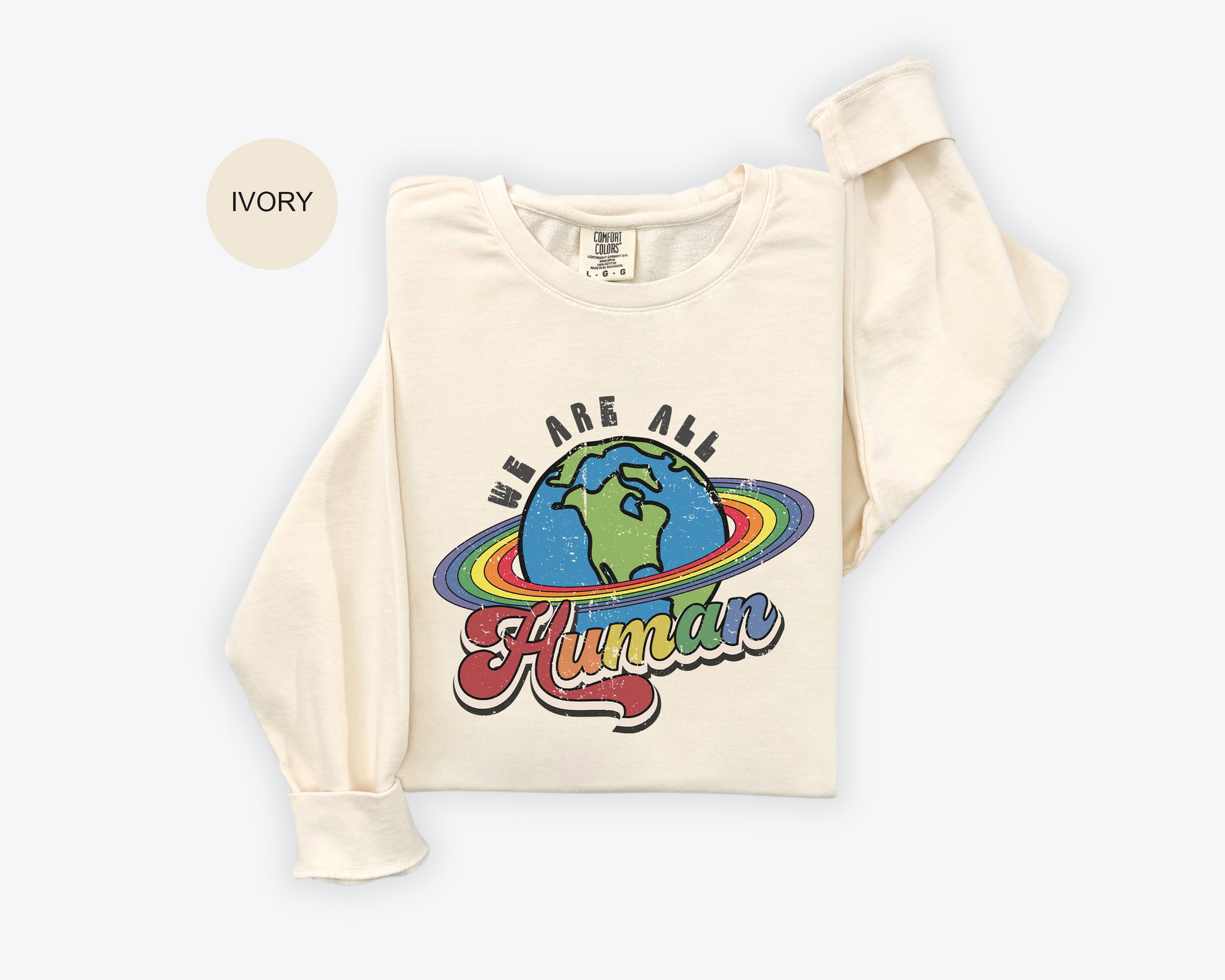 a white shirt with the words we are all human on it