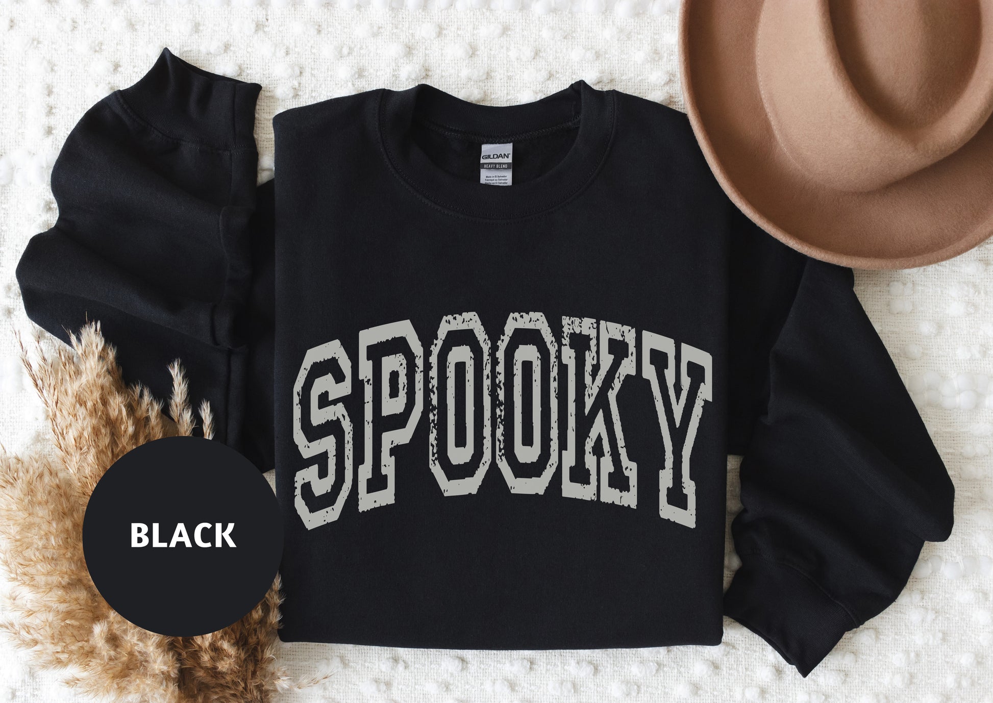 a black sweatshirt with the word spooky on it