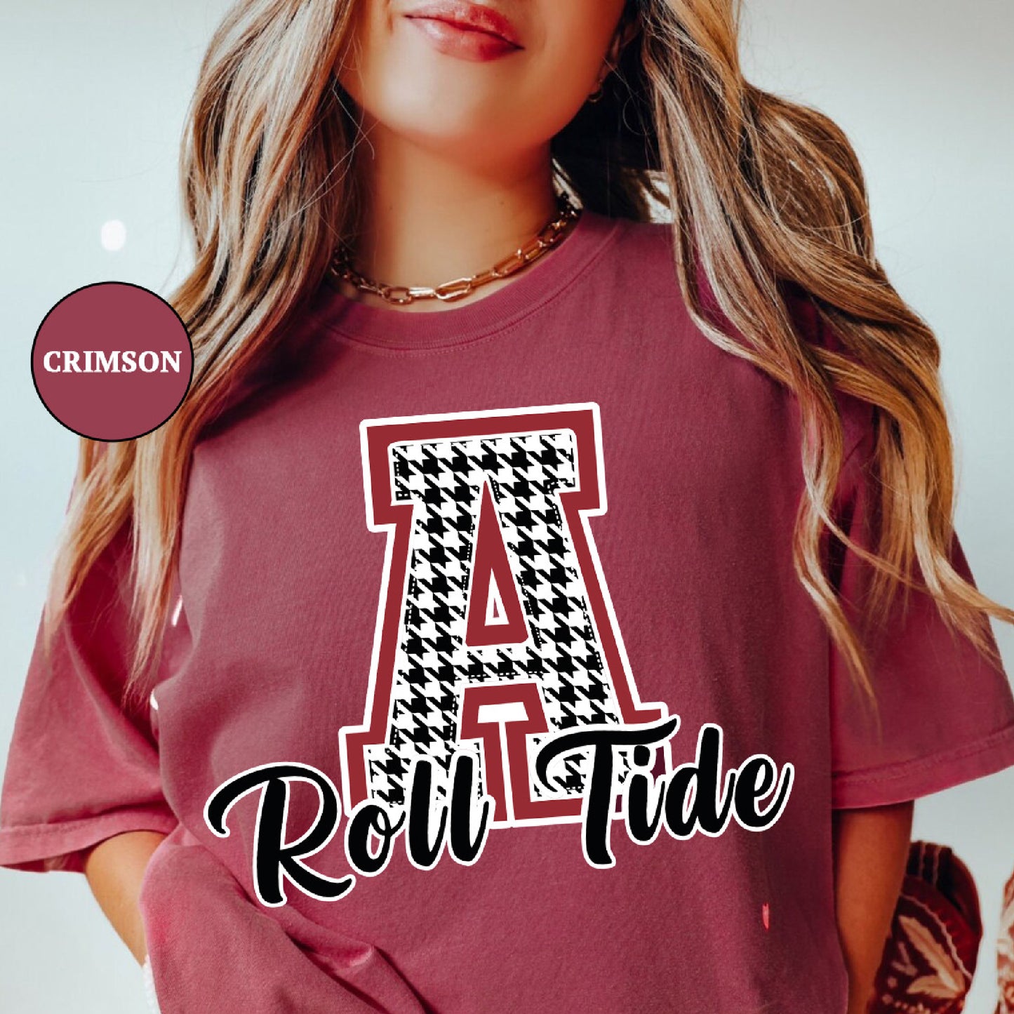 a woman wearing a red shirt with the letter a on it