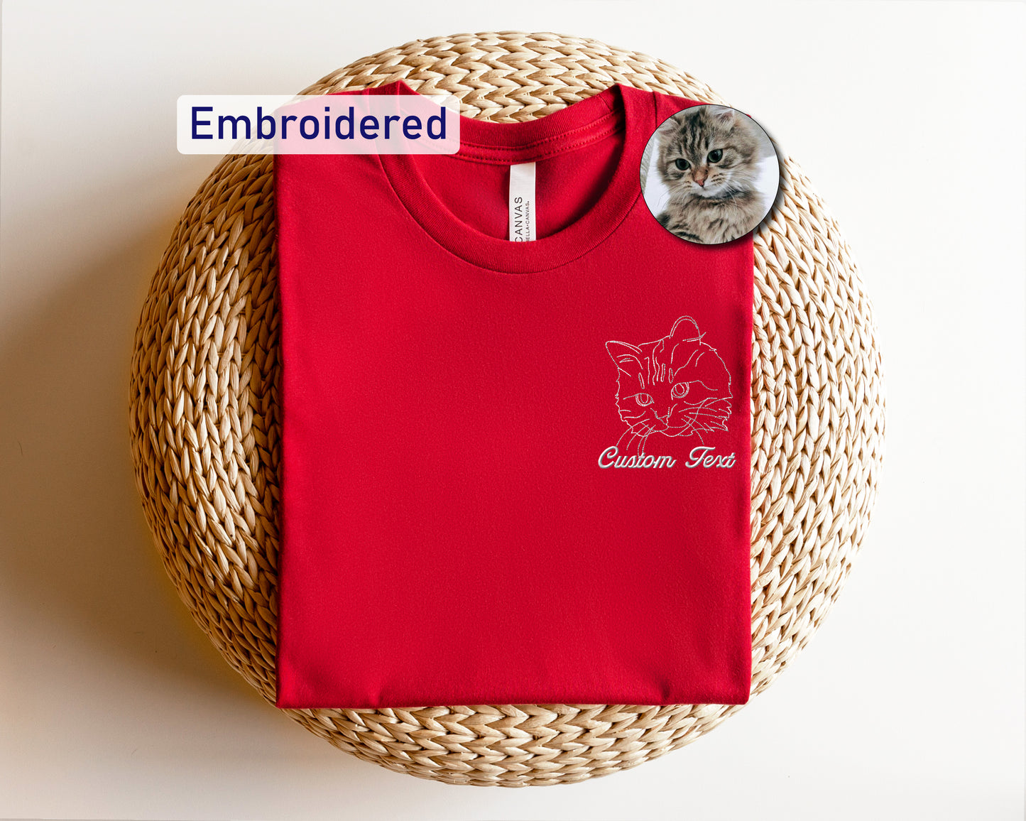 a red t - shirt with a picture of a cat on it