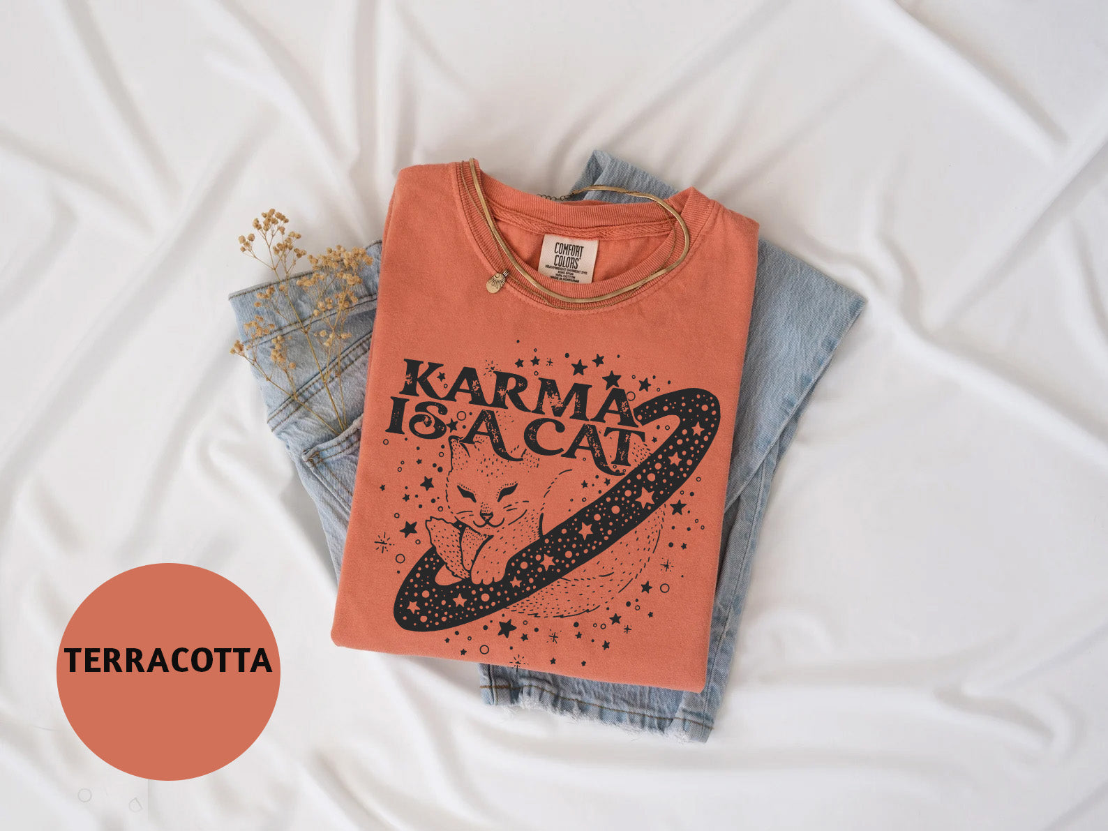 a t - shirt that says karma is a cat on it