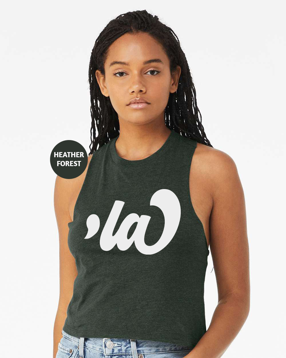 a woman wearing a green tank top with white letters on it