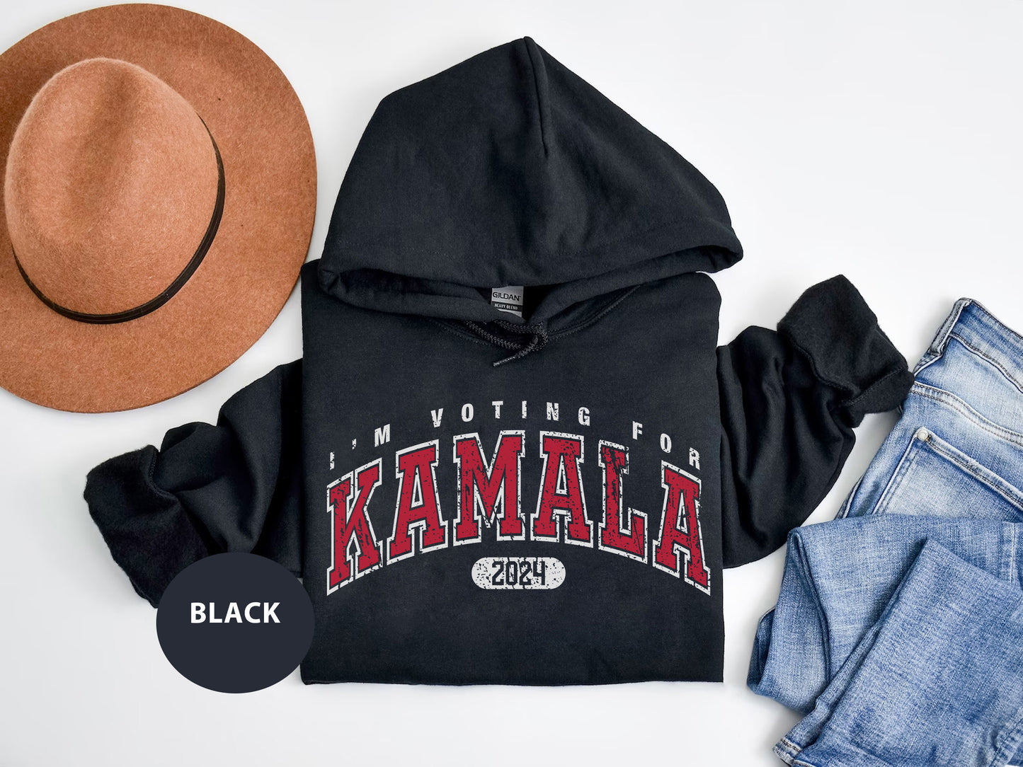 a black hoodie with a hat and jeans