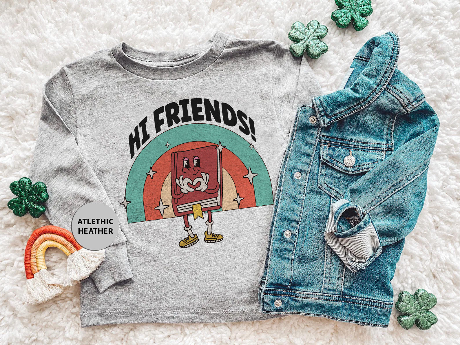 a pair of jeans and a t - shirt on a white carpet