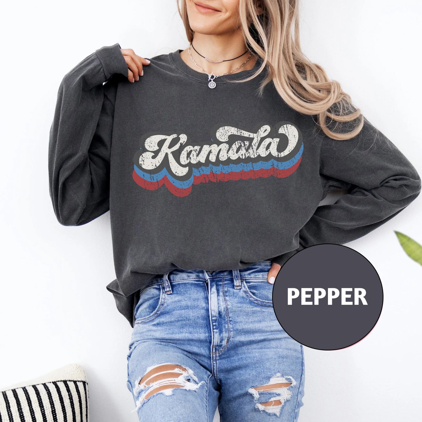 a woman wearing a black sweatshirt with the words kansas on it