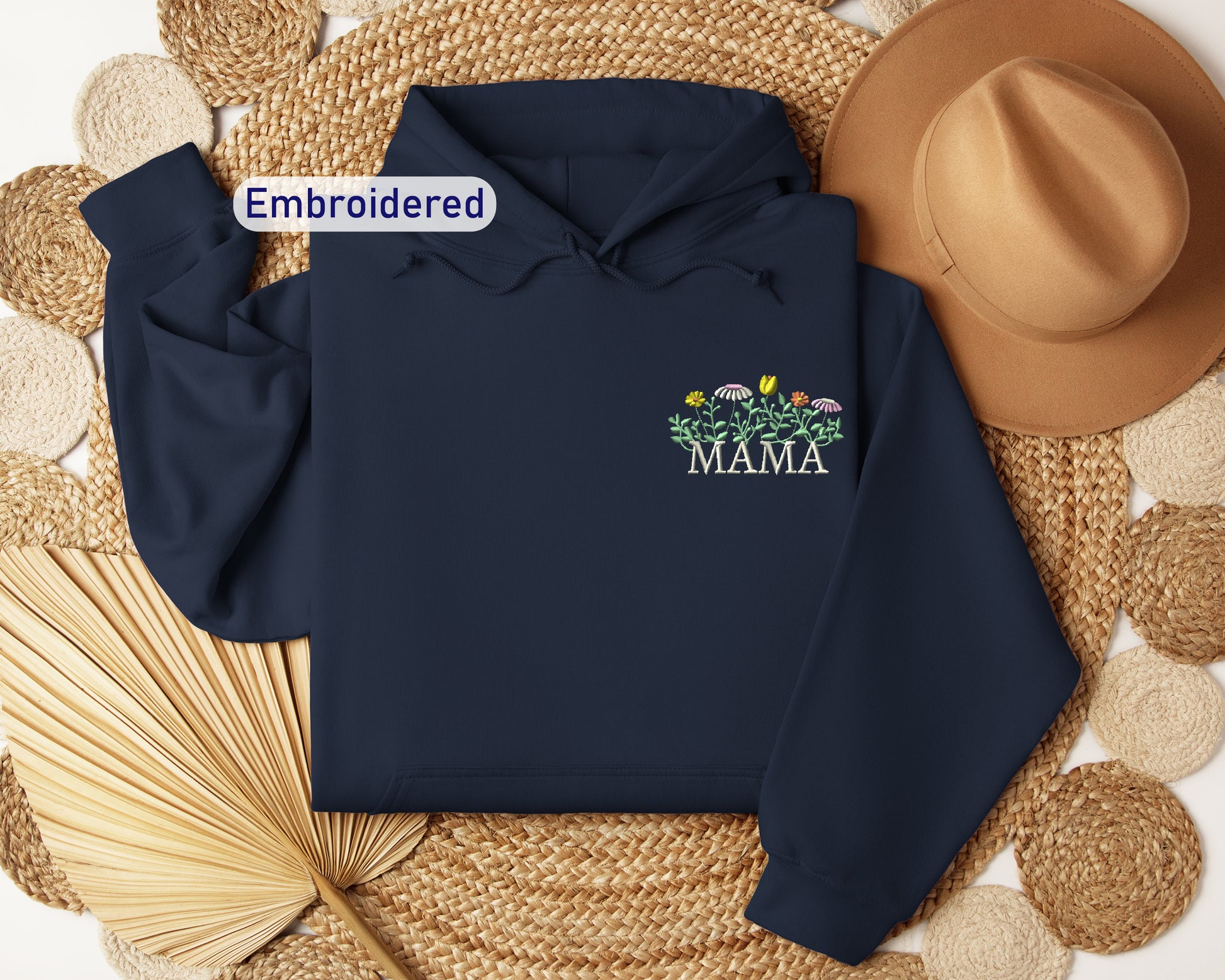 a blue hoodie with the words embroidered on it