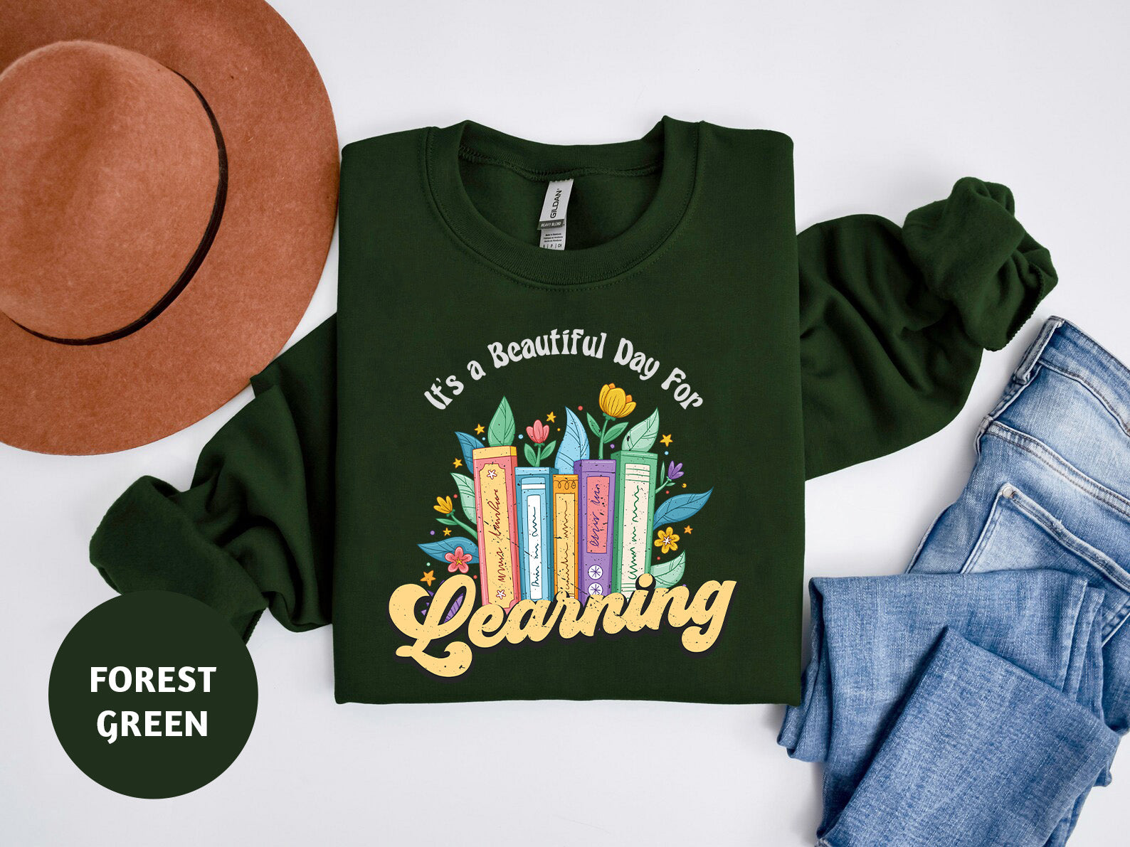 a t - shirt with the words celebrating on it next to jeans and a hat