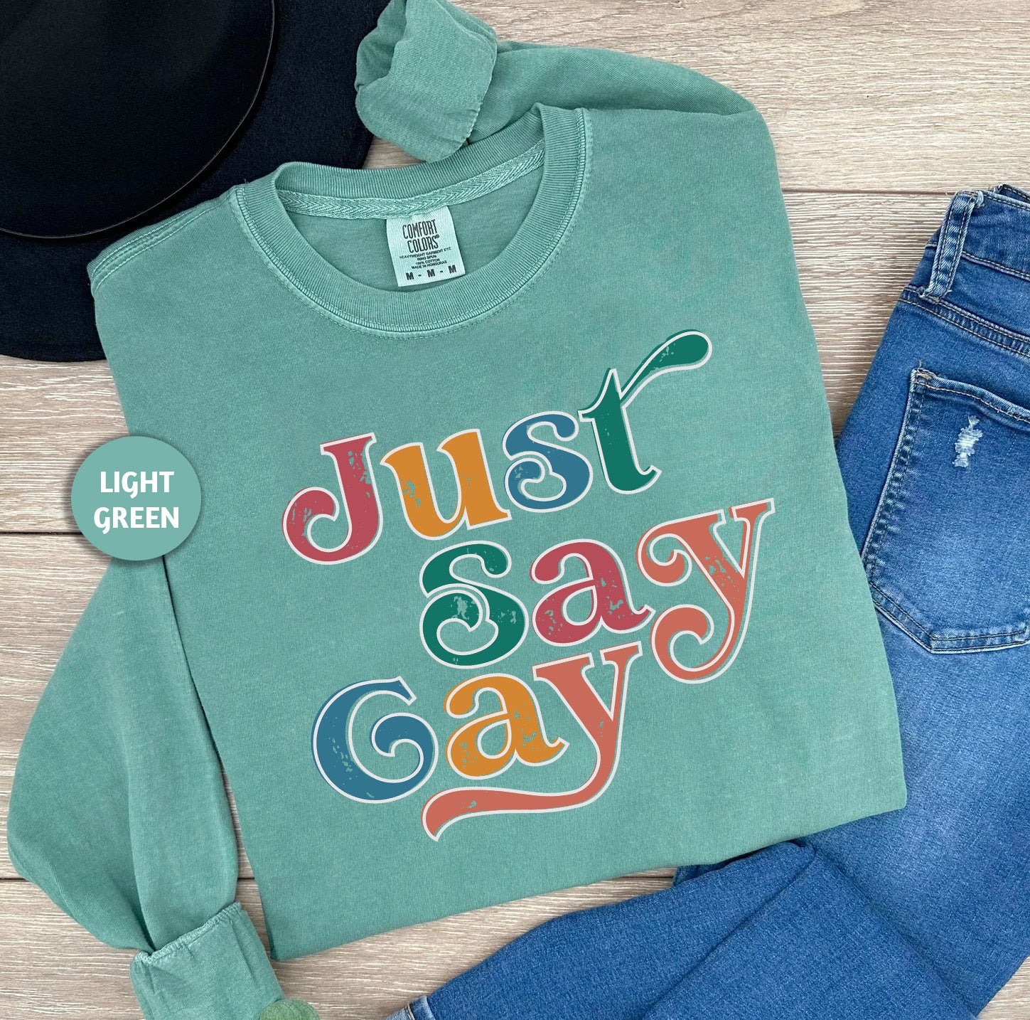 a green shirt that says just say gay on it