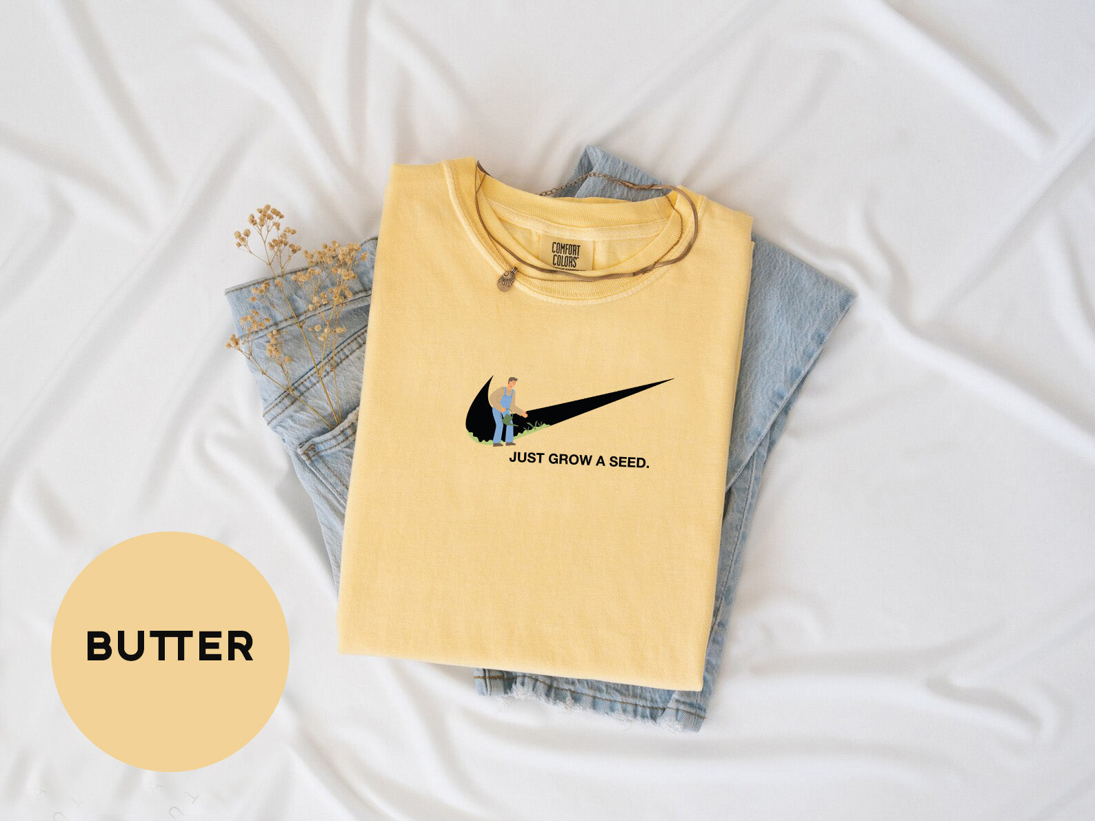 a pair of jeans and a t - shirt on a bed