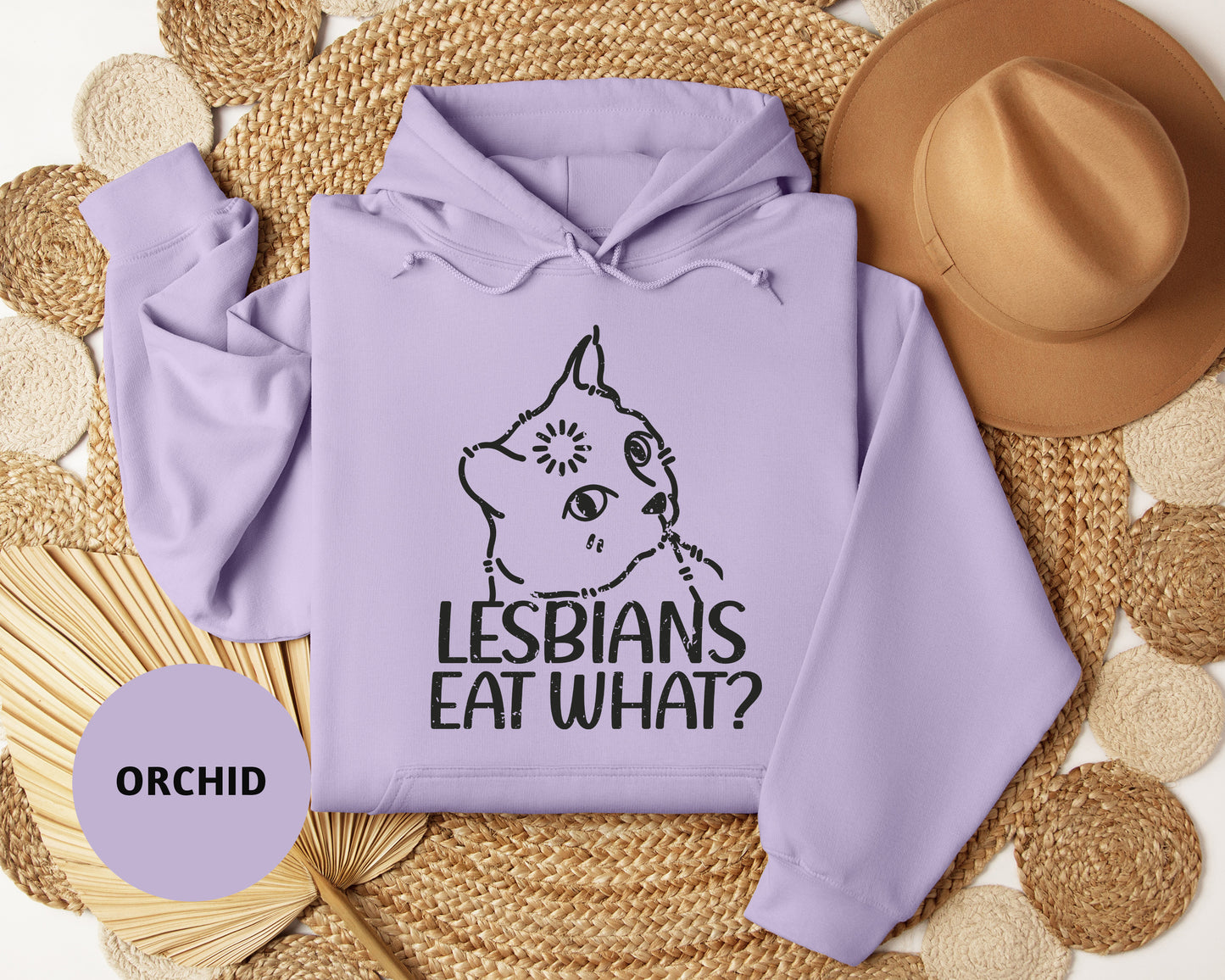 a purple hoodie with the words lesbians eat what on it