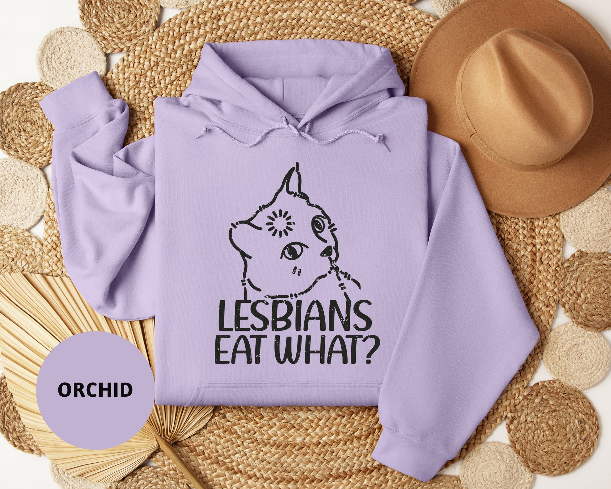 a purple hoodie with the words lesbians eat what on it