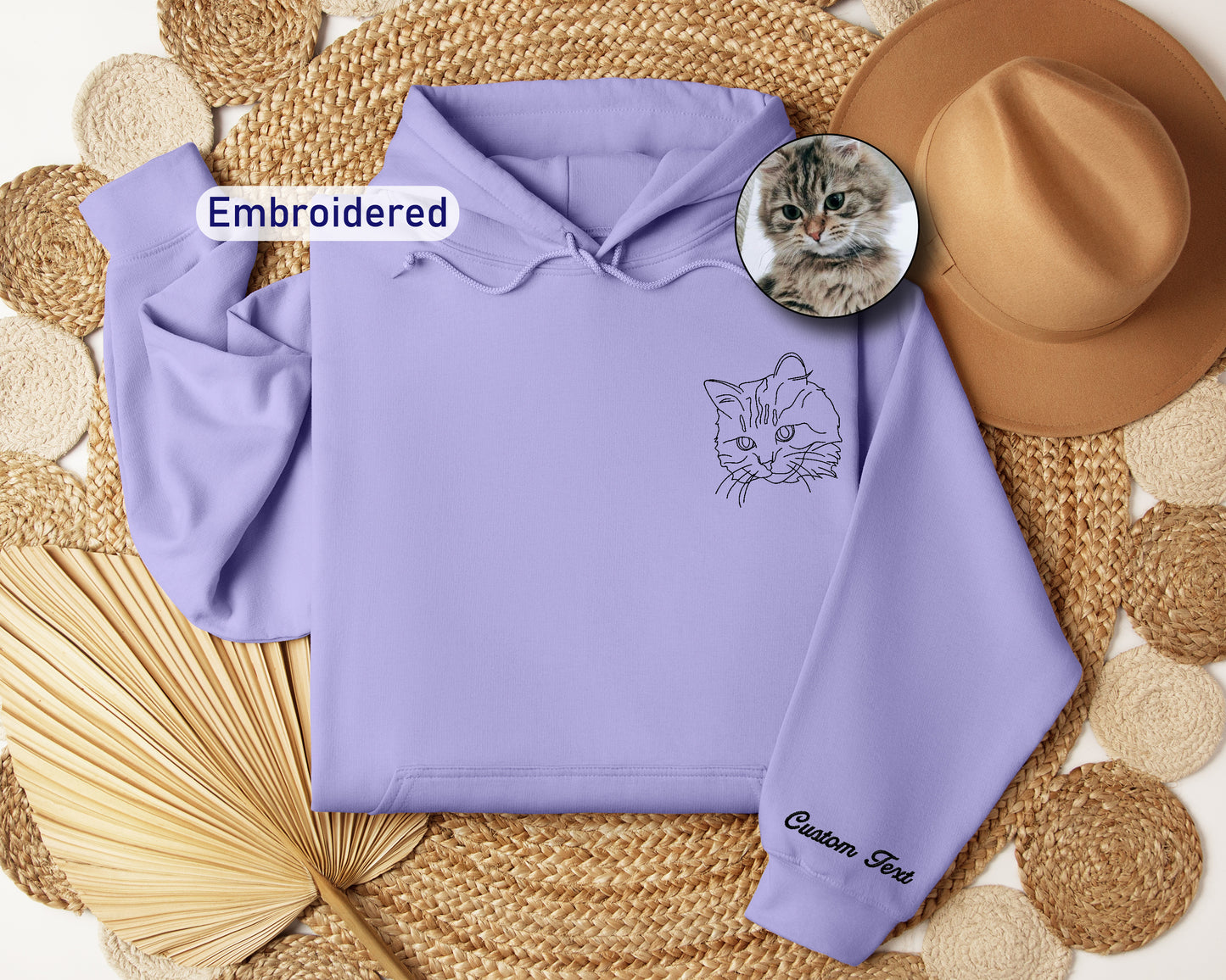 a purple hoodie with a picture of a cat on it