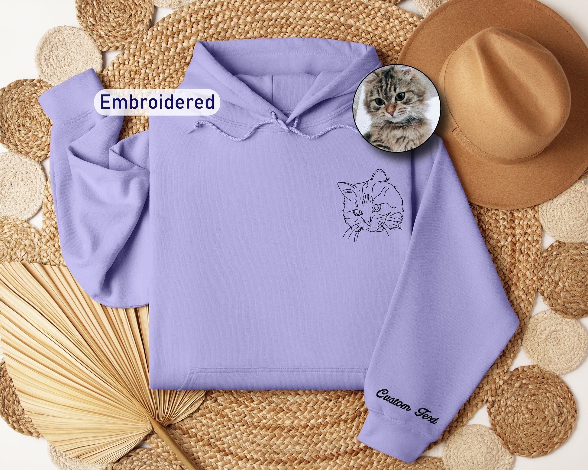 a purple hoodie with a picture of a cat on it
