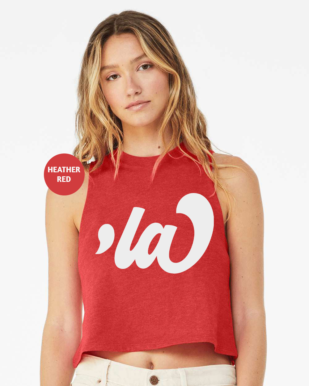 a woman wearing a red crop top with the word la on it