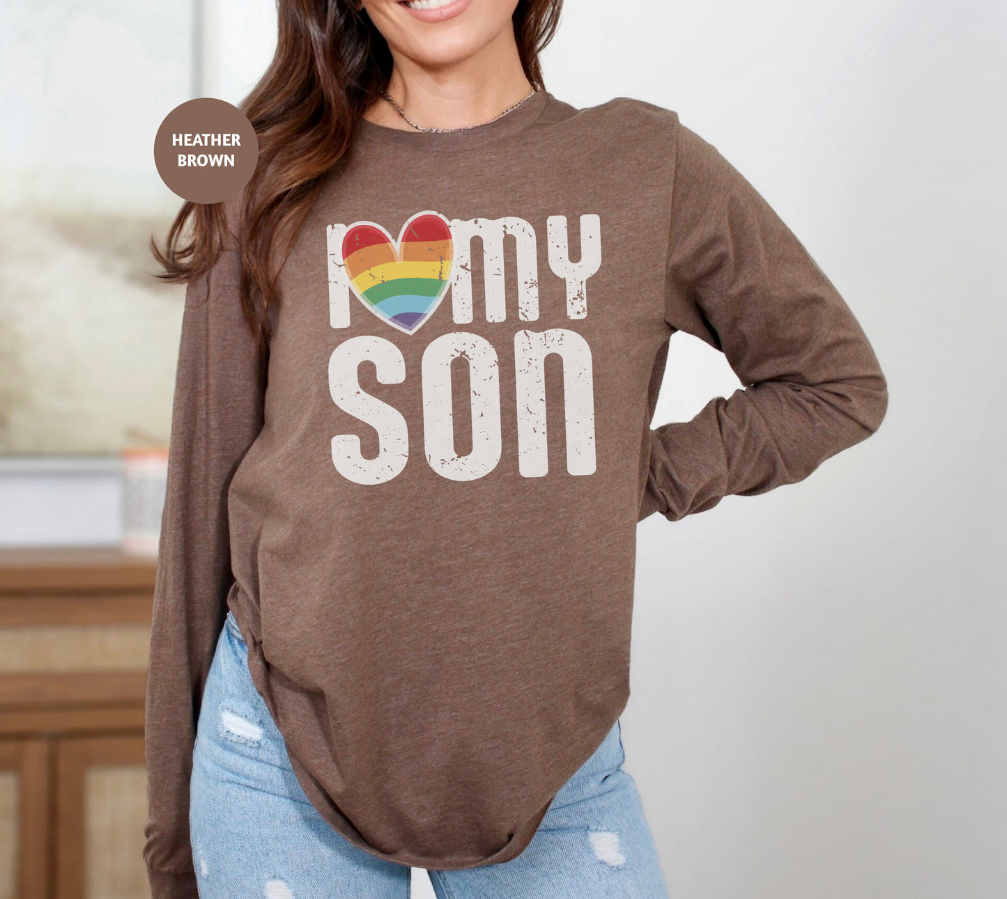 a woman wearing a brown shirt with the words i love my son on it