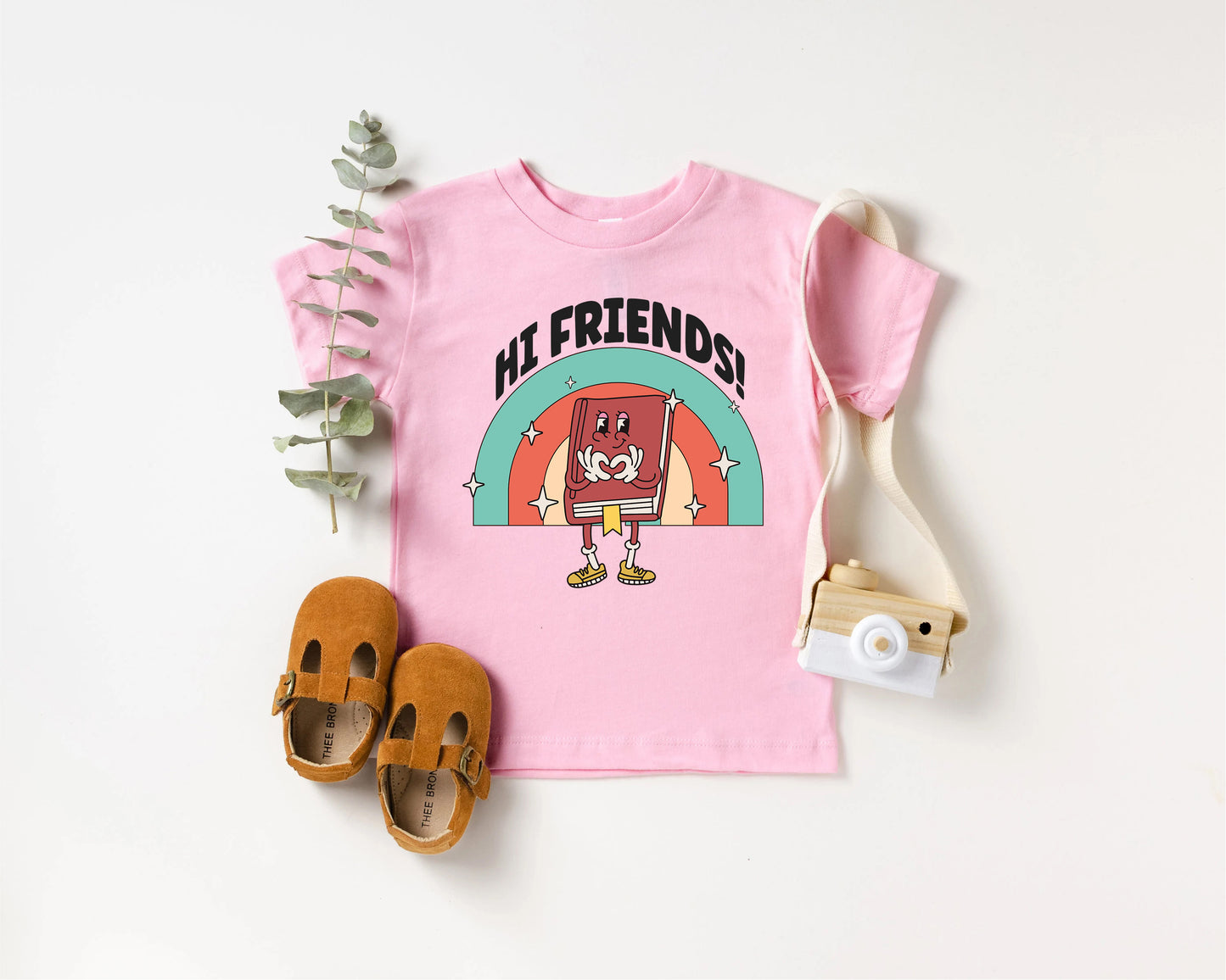 a pink shirt with a picture of a cartoon character on it