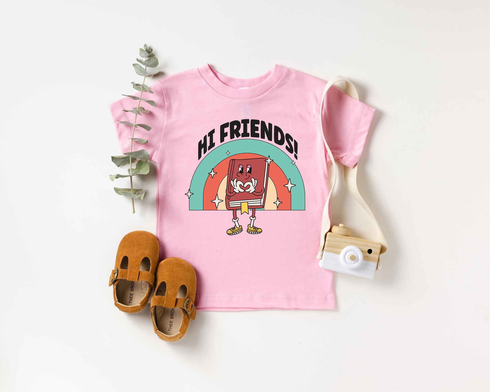 a pink shirt with a picture of a cartoon character on it