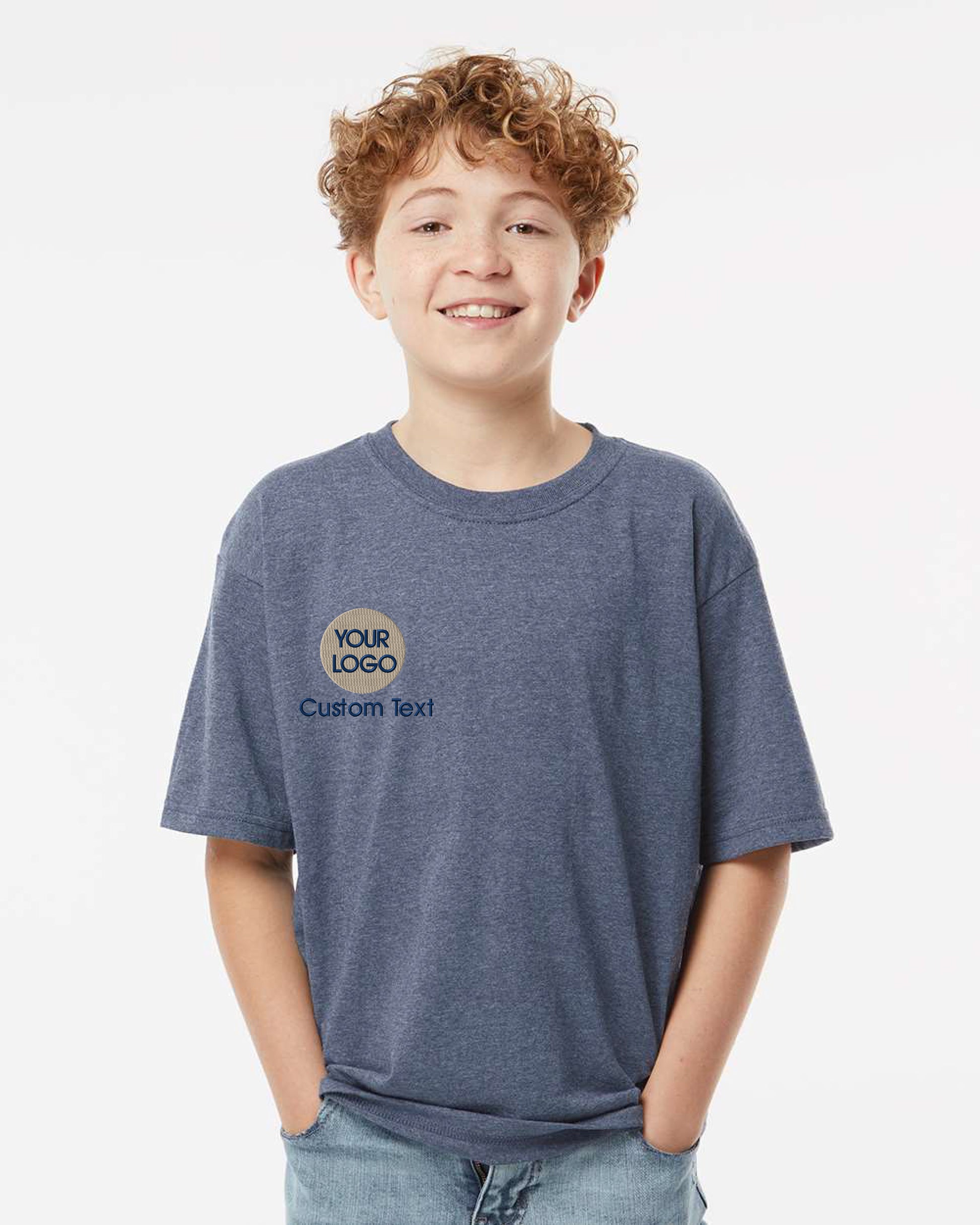 a boy with curly hair wearing a blue shirt