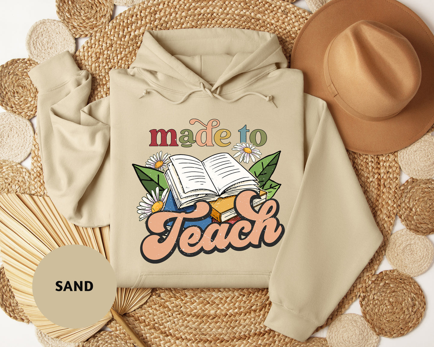 a hoodie with the words made to teach on it